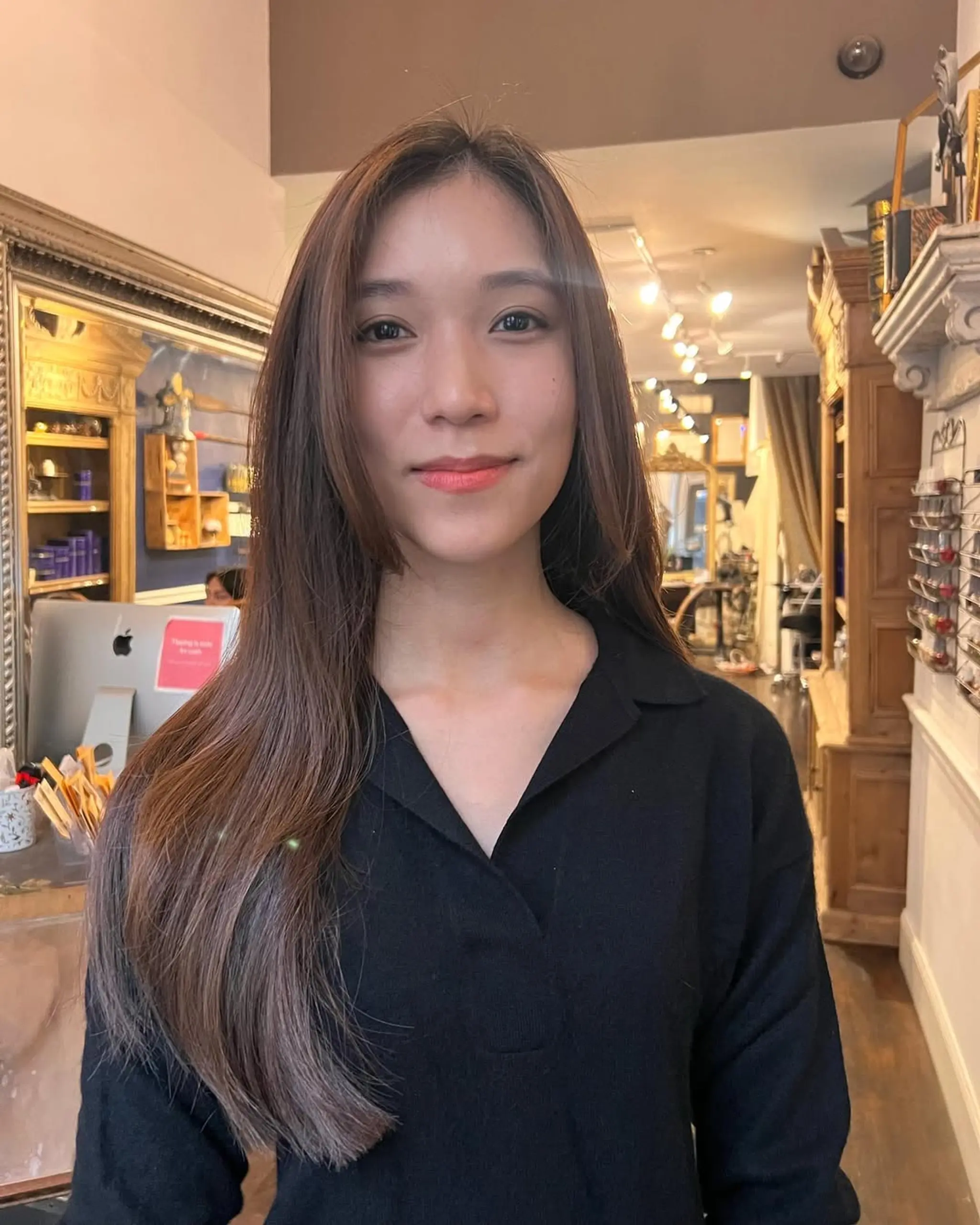 A sleek, long straight hairstyle with a smooth, glossy finish and a subtle side part. 1