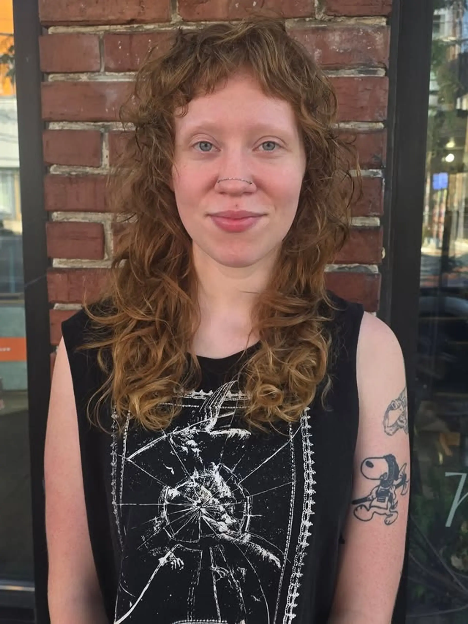 A curly shag with textured layers and micro bangs. 1