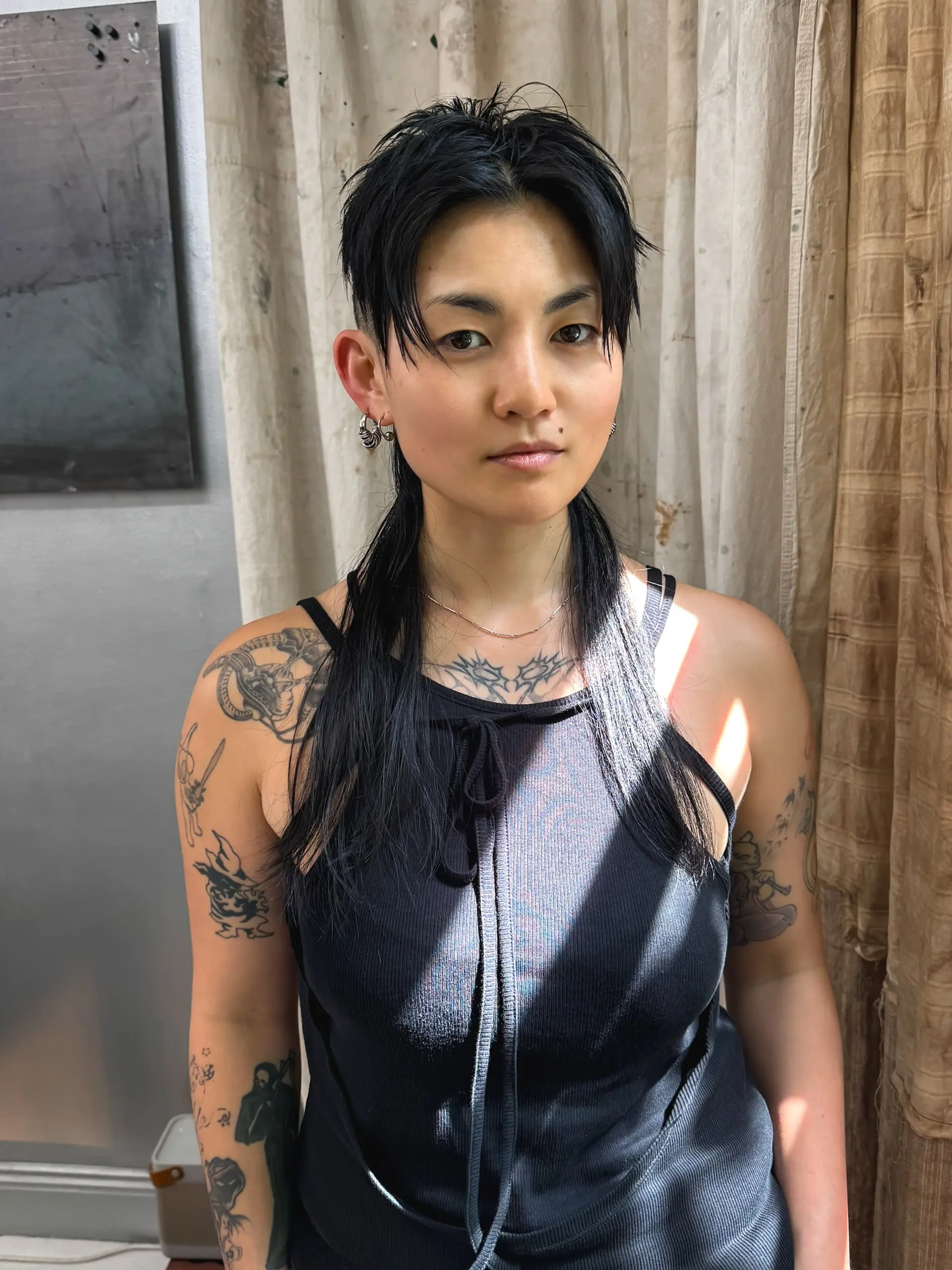 A modern take on the classic mullet, featuring a sleek, straight finish with choppy layers for an edgy look. 1