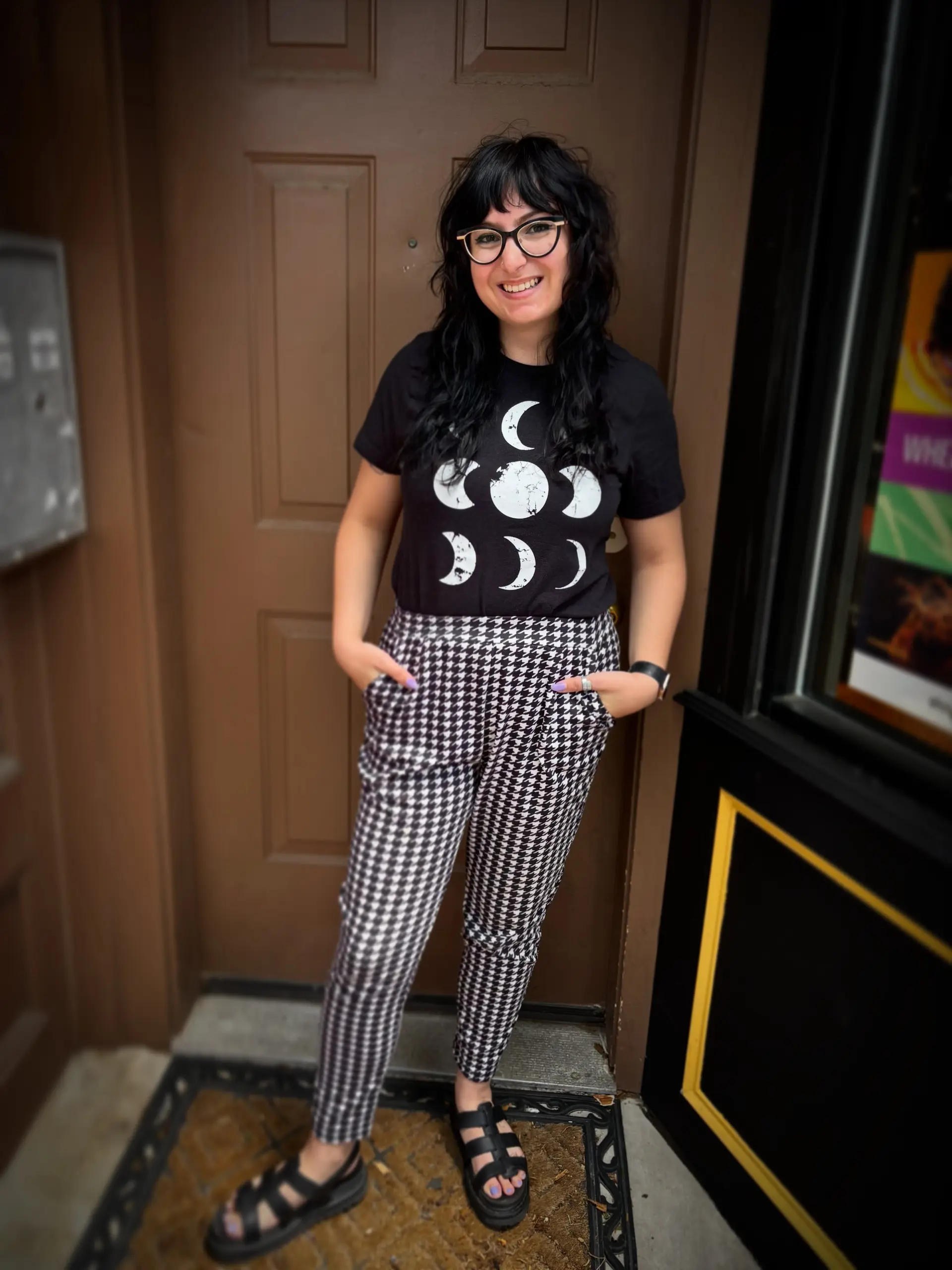A mid-length black shag haircut with face-framing layers, full bangs, and naturally diffused waves. 1