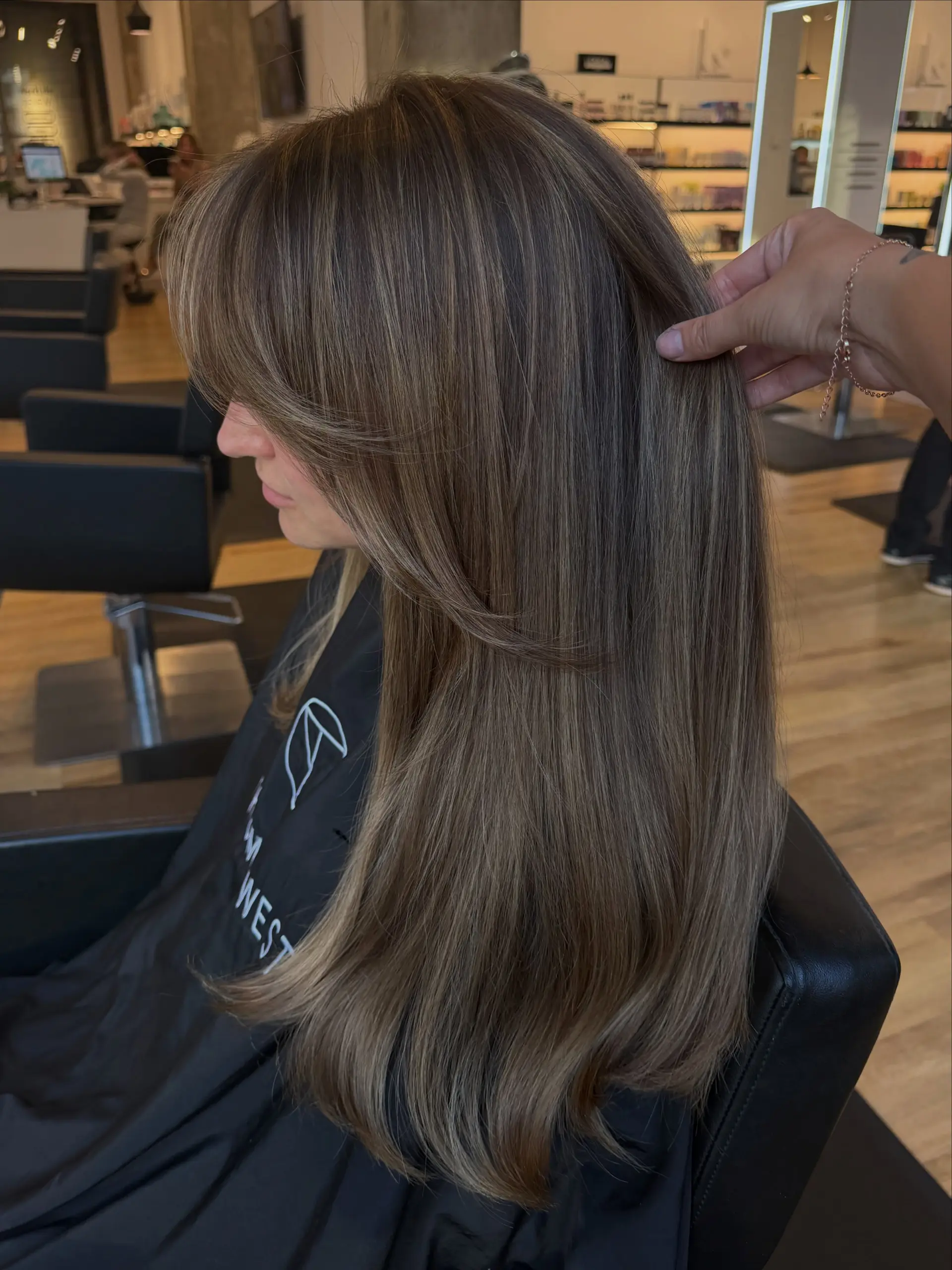 Long straight ash brown hair with finely blended balayage highlights and soft face-framing curtain bangs. 1