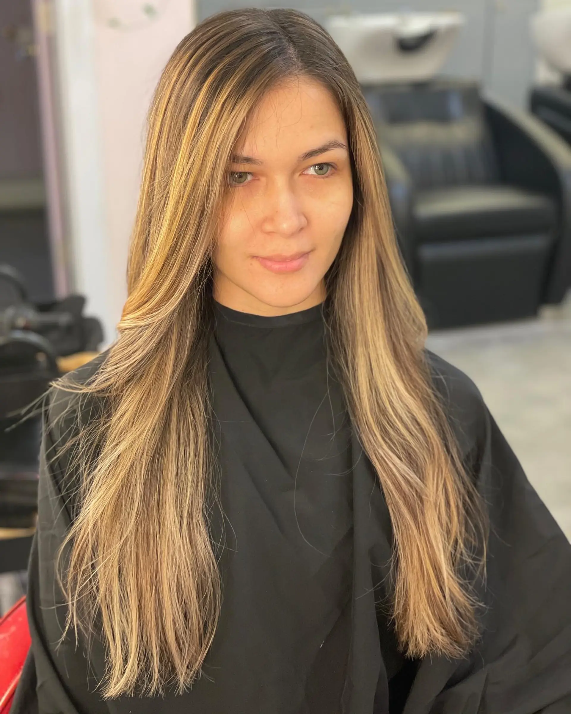 Long, straight hair with bronde balayage and subtle waves. 1