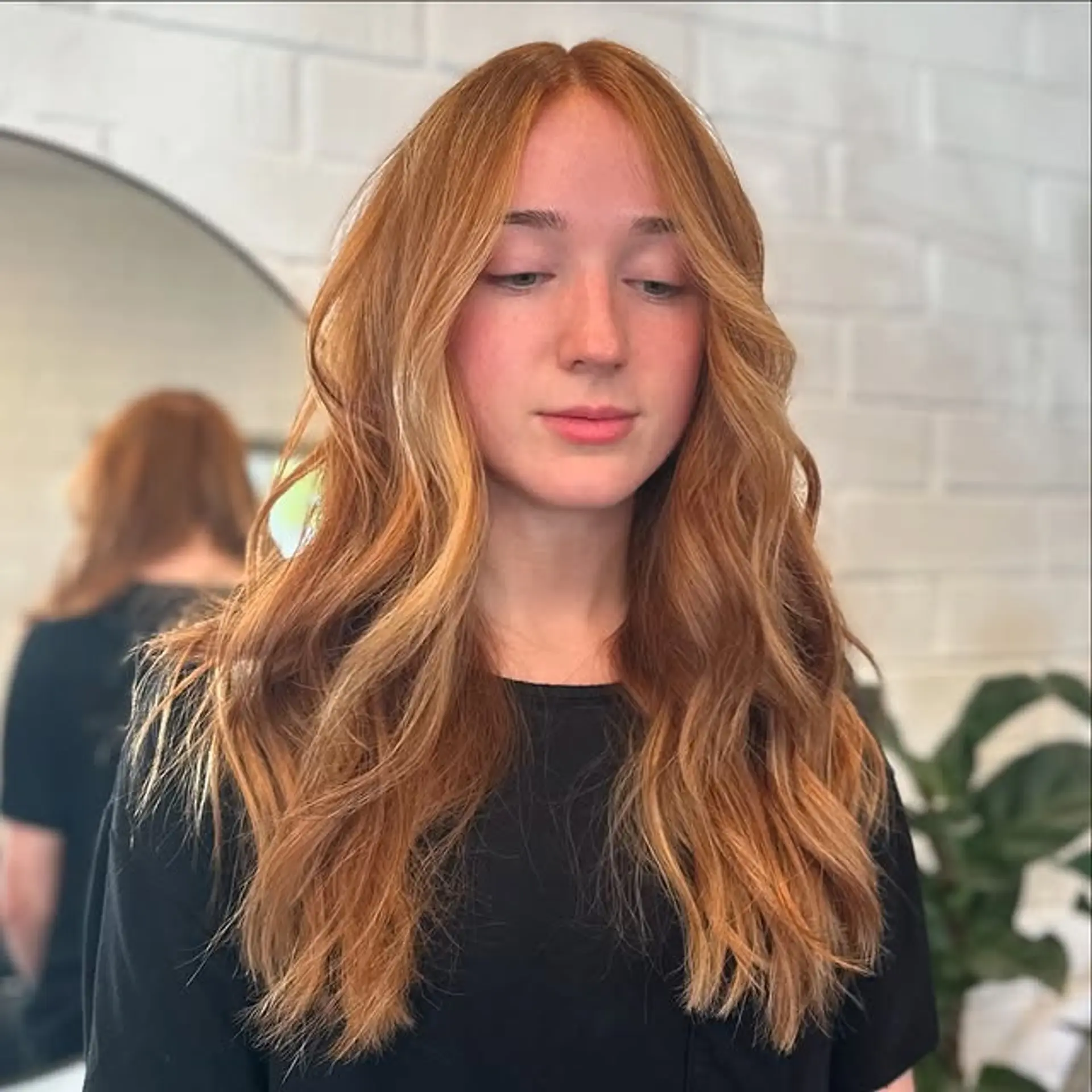 Long wavy hair with copper balayage and blonde highlights. 1