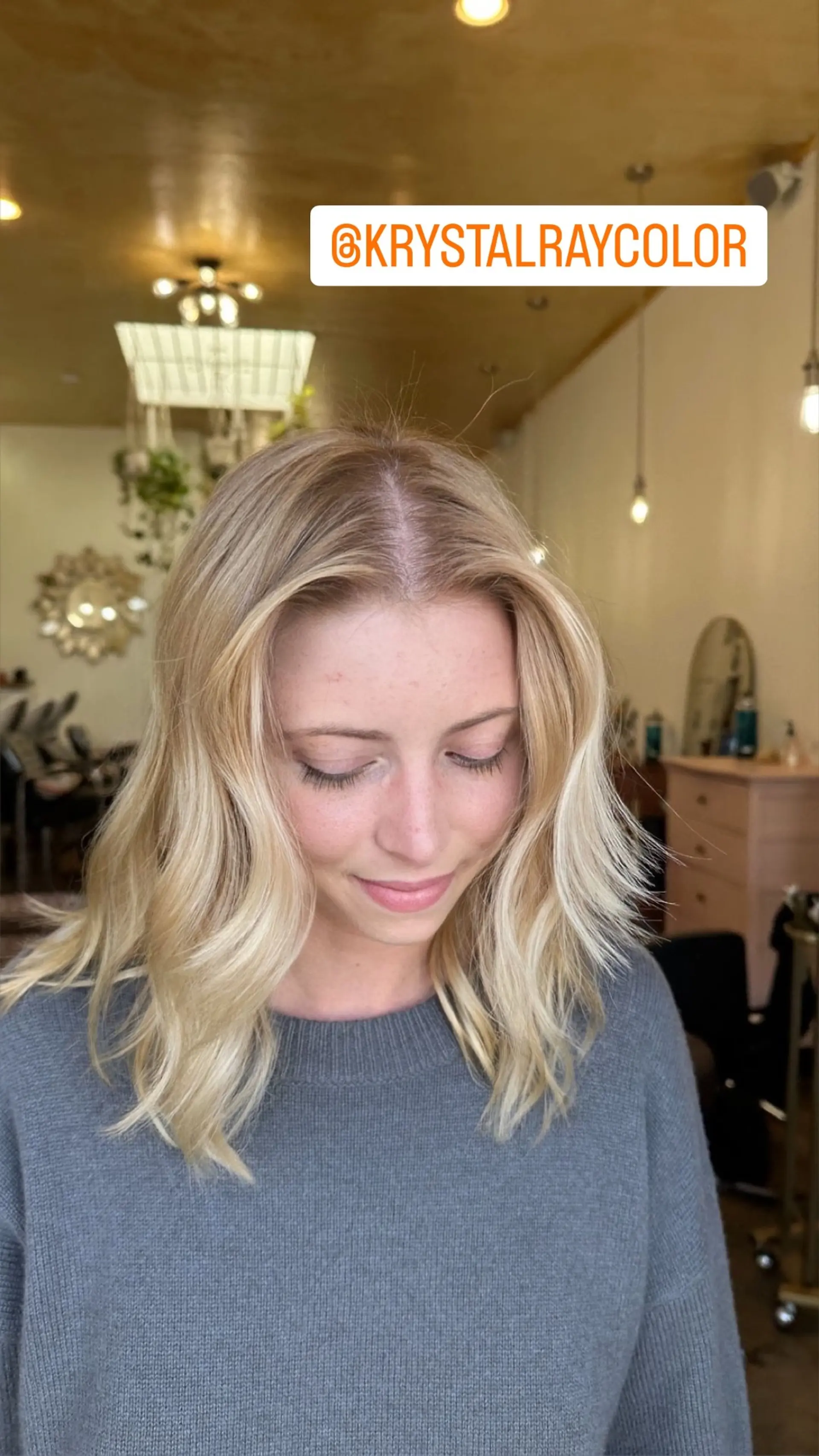 Medium-length wavy hair with a cool, icy blonde color. Perfect for a trendy, low-maintenance style. 1