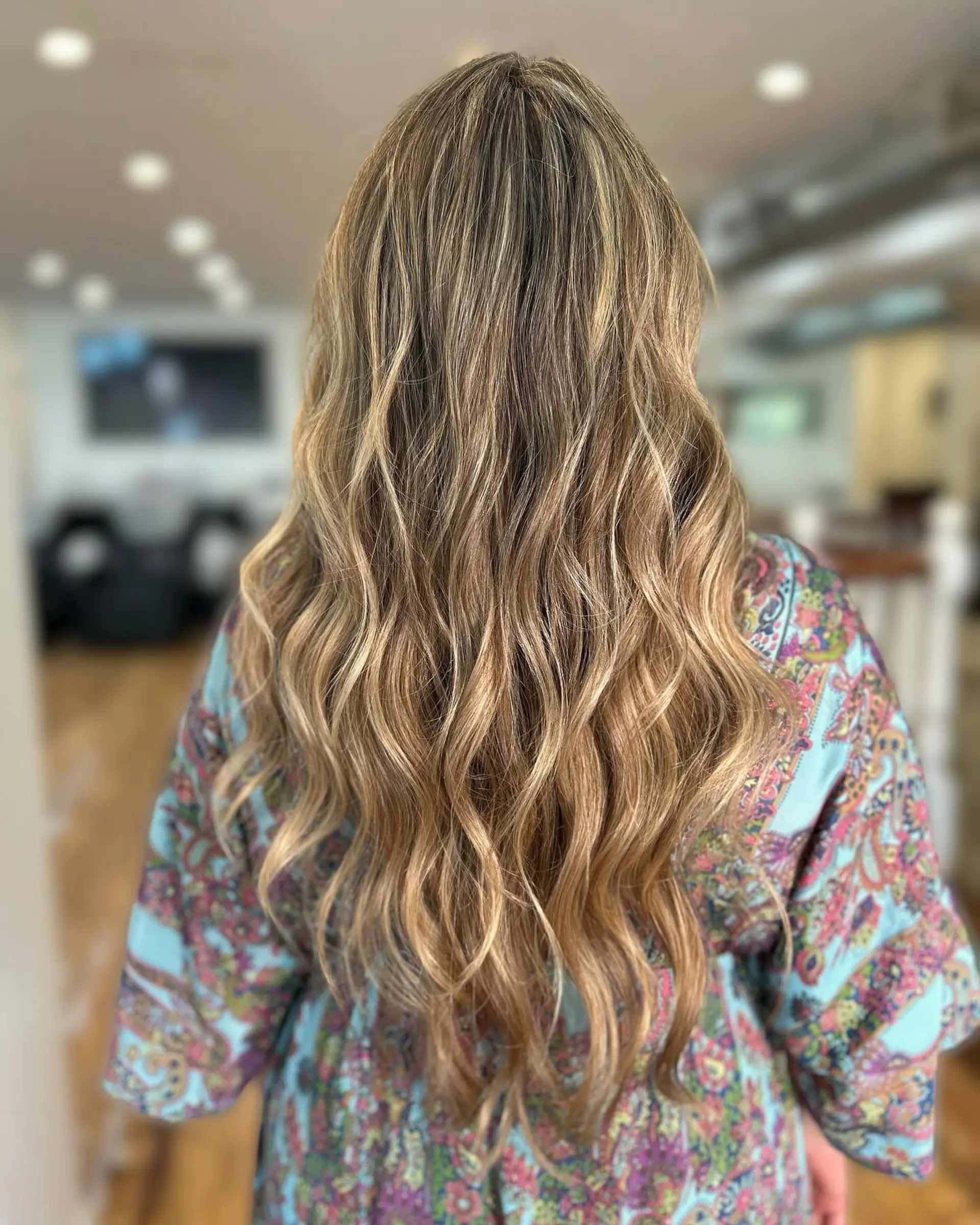 Long, beachy waves with a balayage or ombre color effect. 1