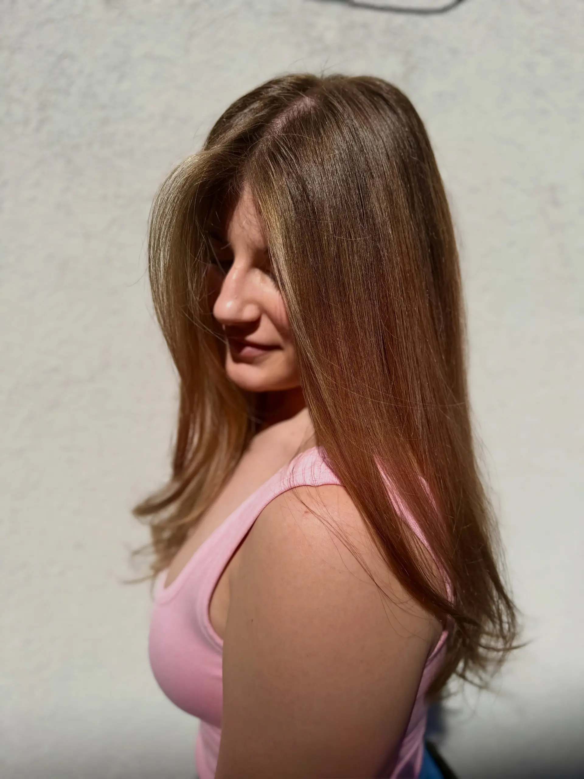 Long, smooth light brown hair enhanced with seamless warm honey and caramel balayage highlights. 1
