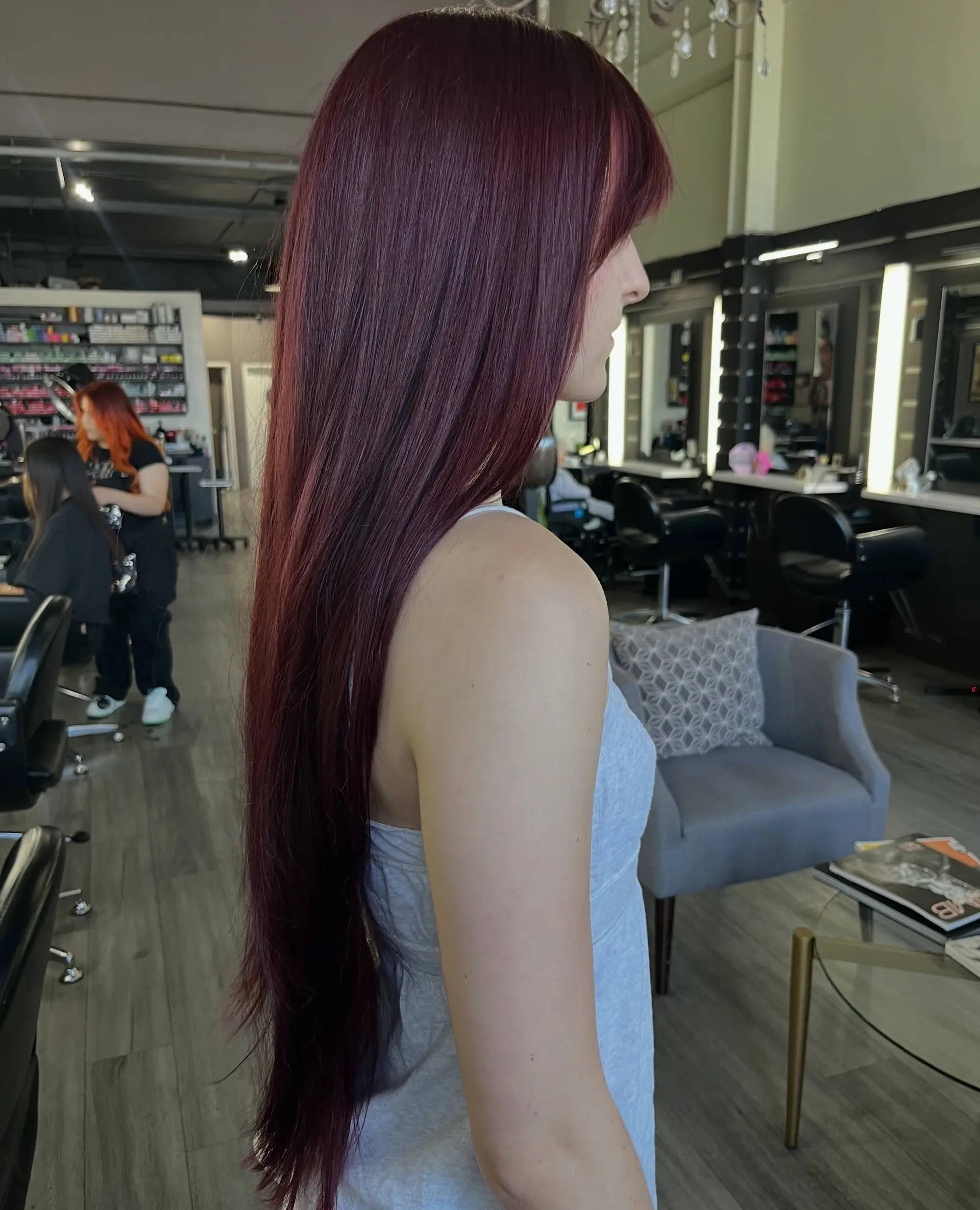 Ultra-long, smooth, and straight hair colored in a rich deep burgundy hue with bangs. 1