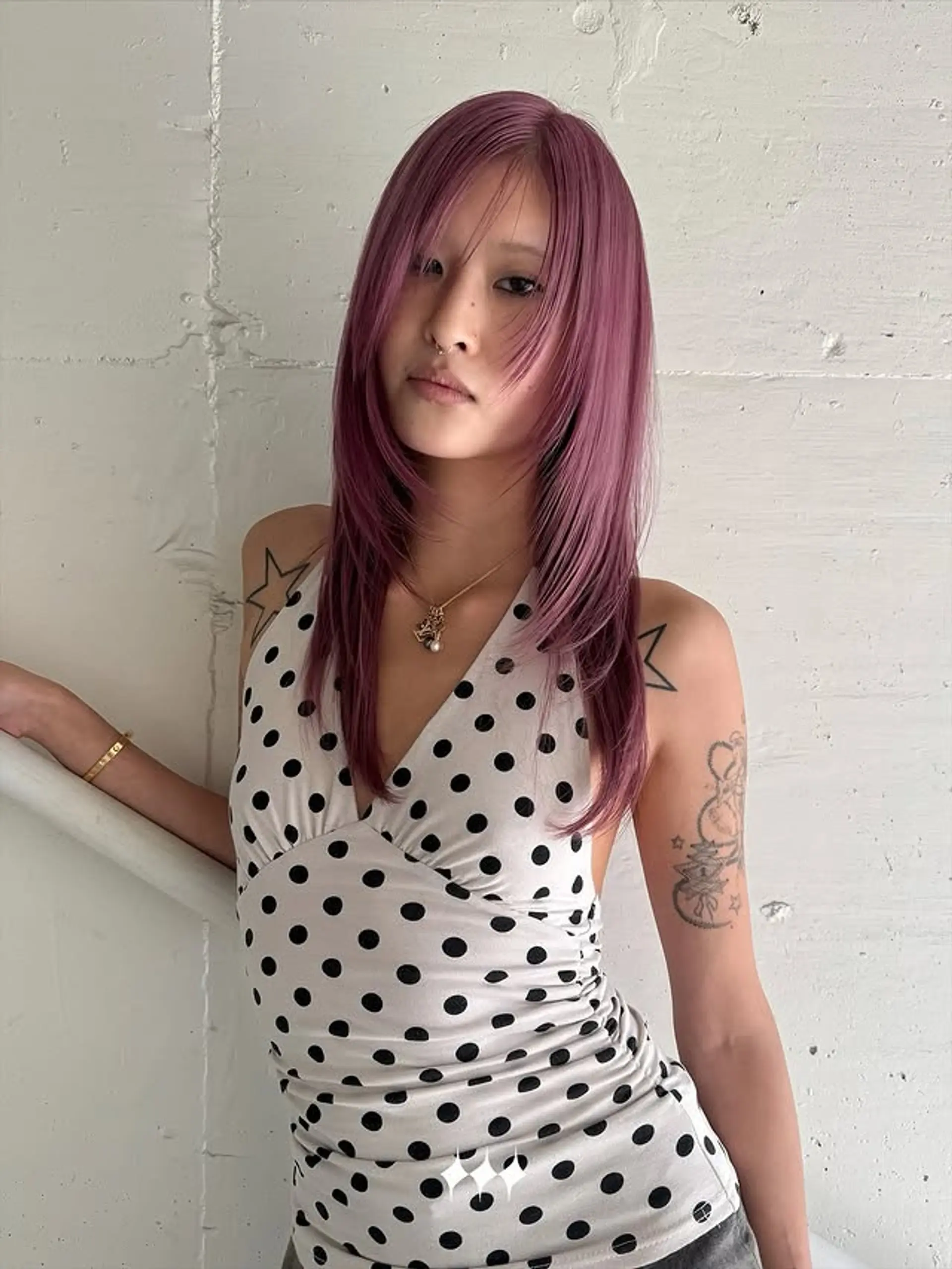 A medium-length layered haircut with face-framing layers. 1