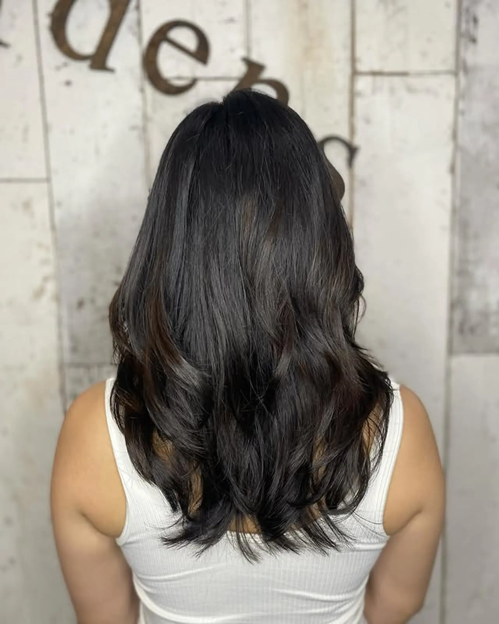 A layered, wavy medium-length cut. 1