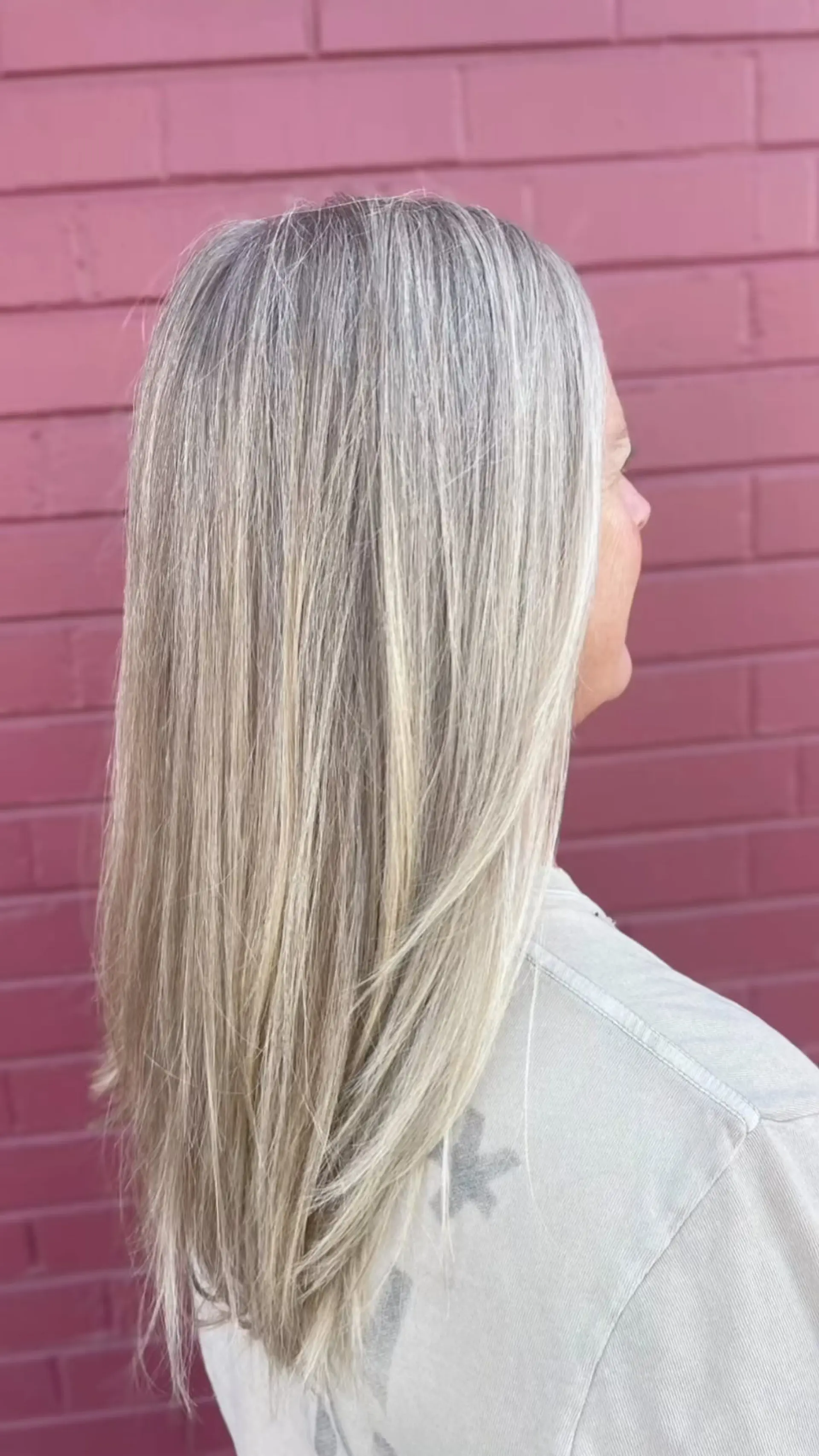 Straight, long hair featuring seamlessly blended cool-toned blonde and grey highlights with soft layering at the ends. 1