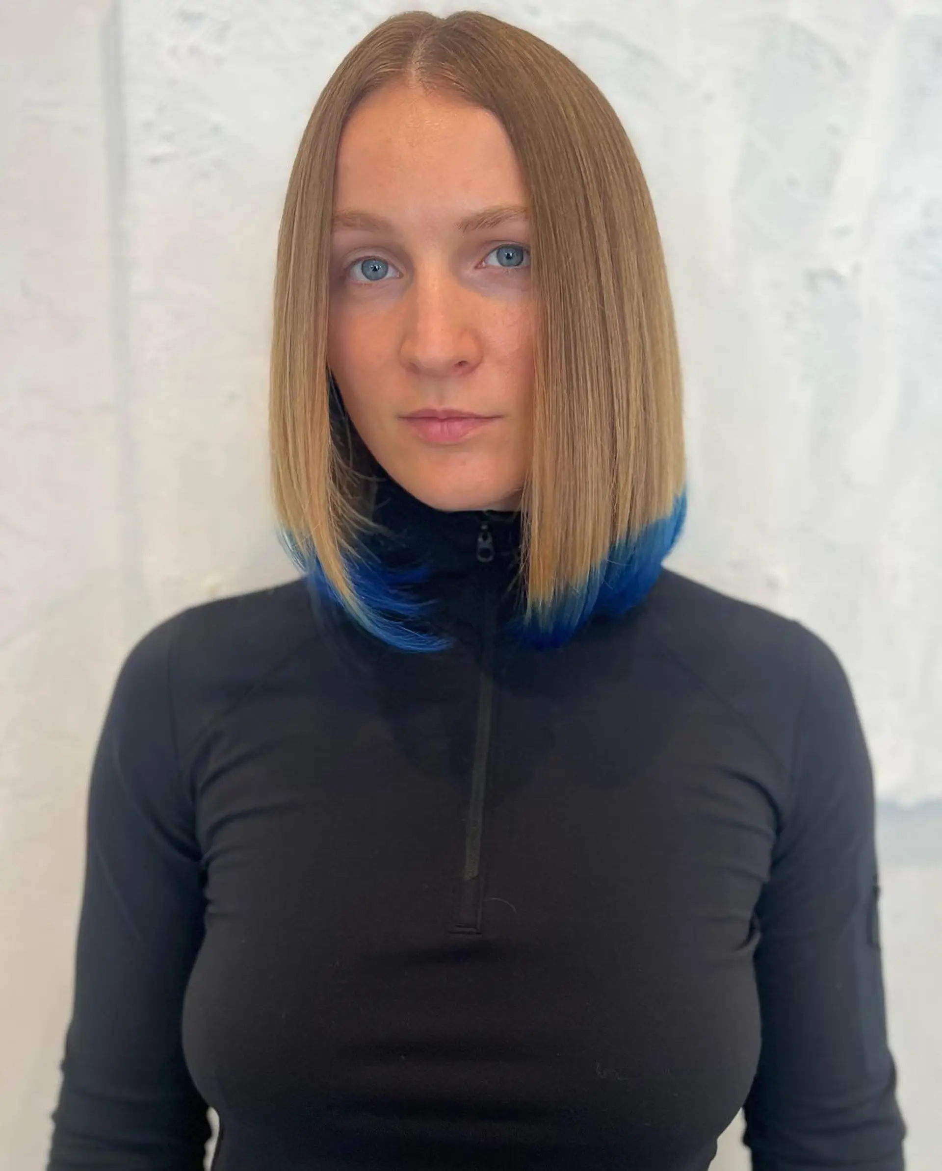 Straight, long bob with a blunt cut and a blue ombre effect at the ends. 2