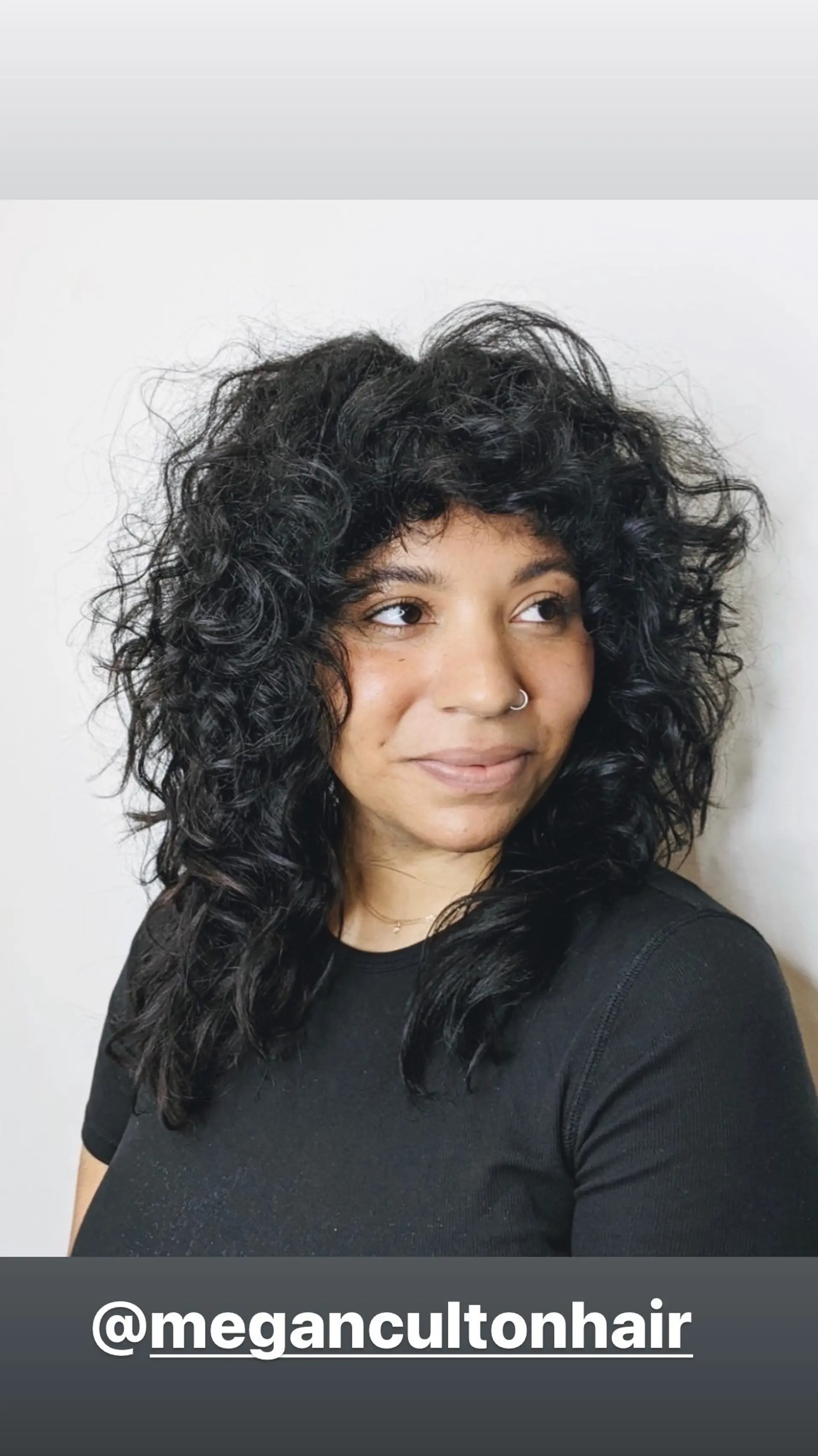 A layered, curly shag with a full fringe. 1