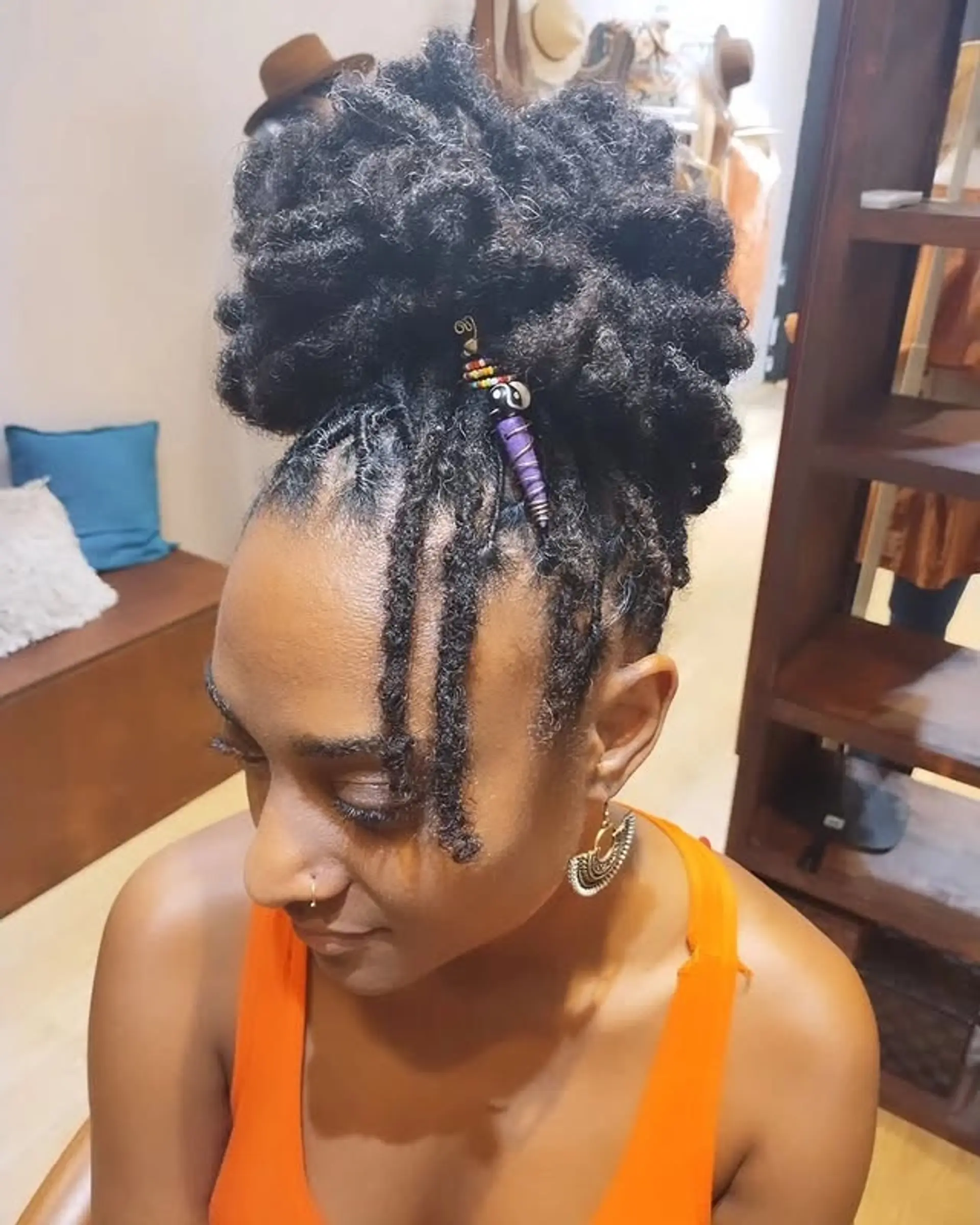 A twisted crown updo with face-framing locs. 1