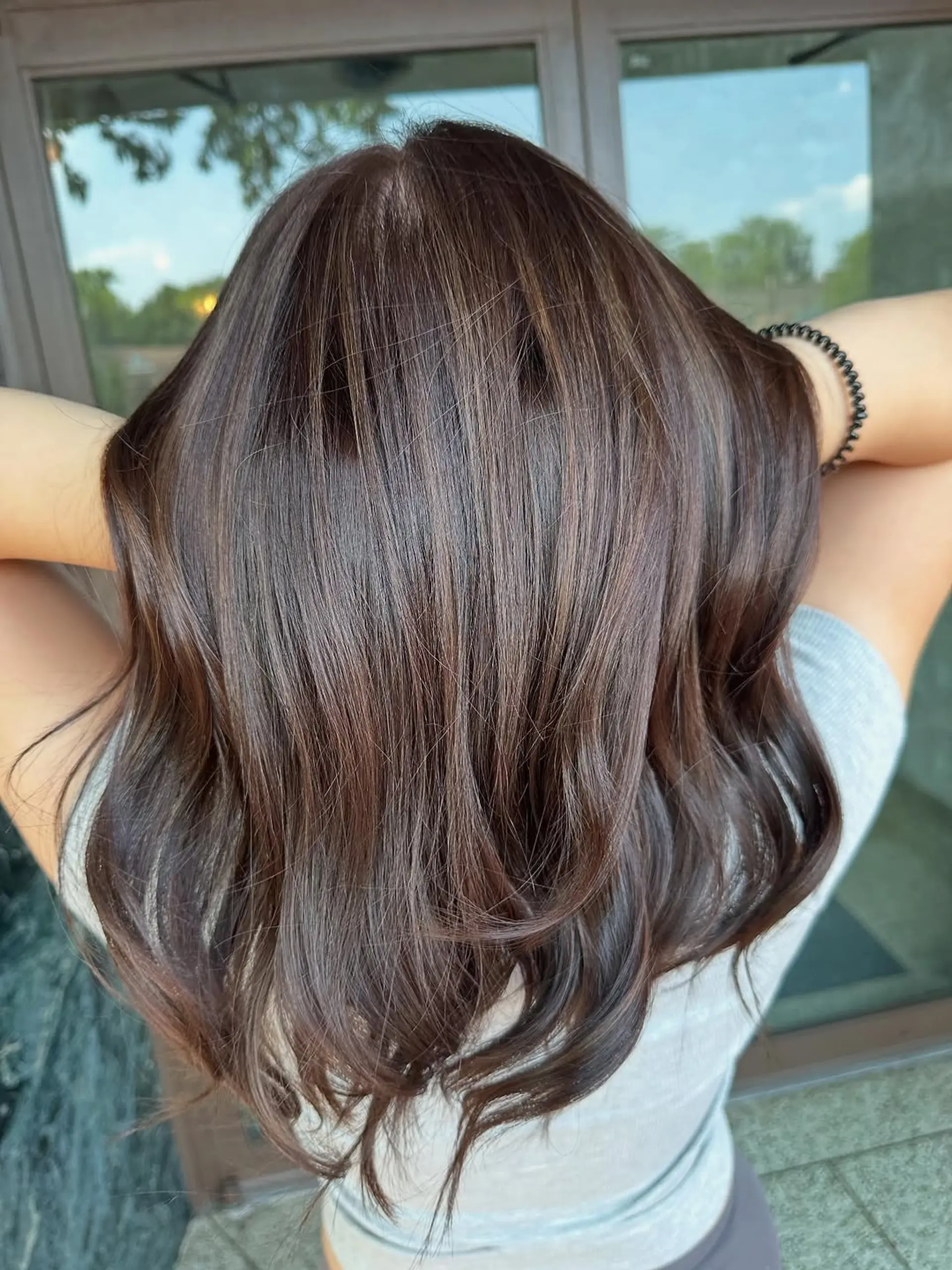A soft, dimensional brunette balayage with subtle highlights. 1