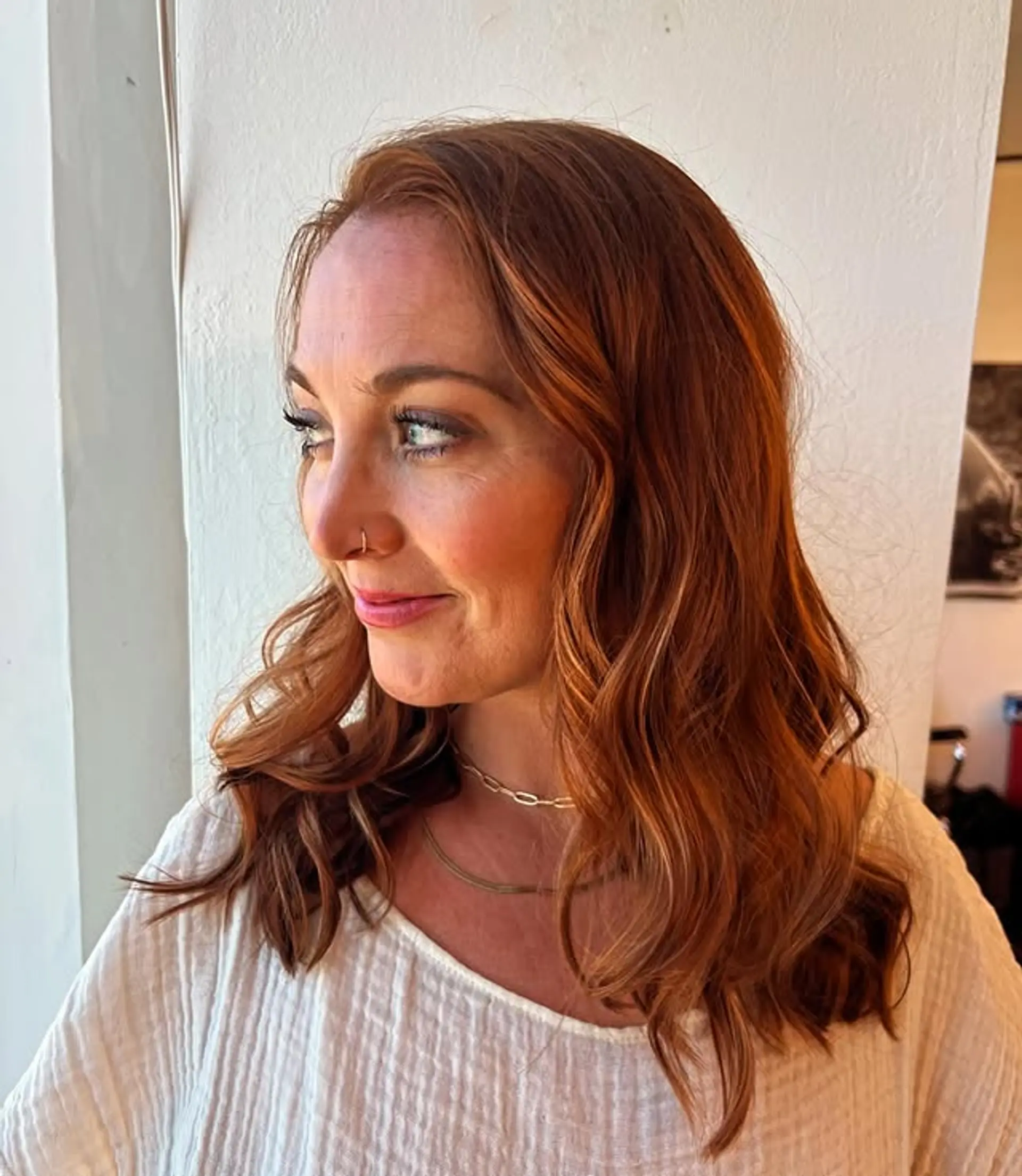 Medium length wavy hairstyle with layered waves. 1