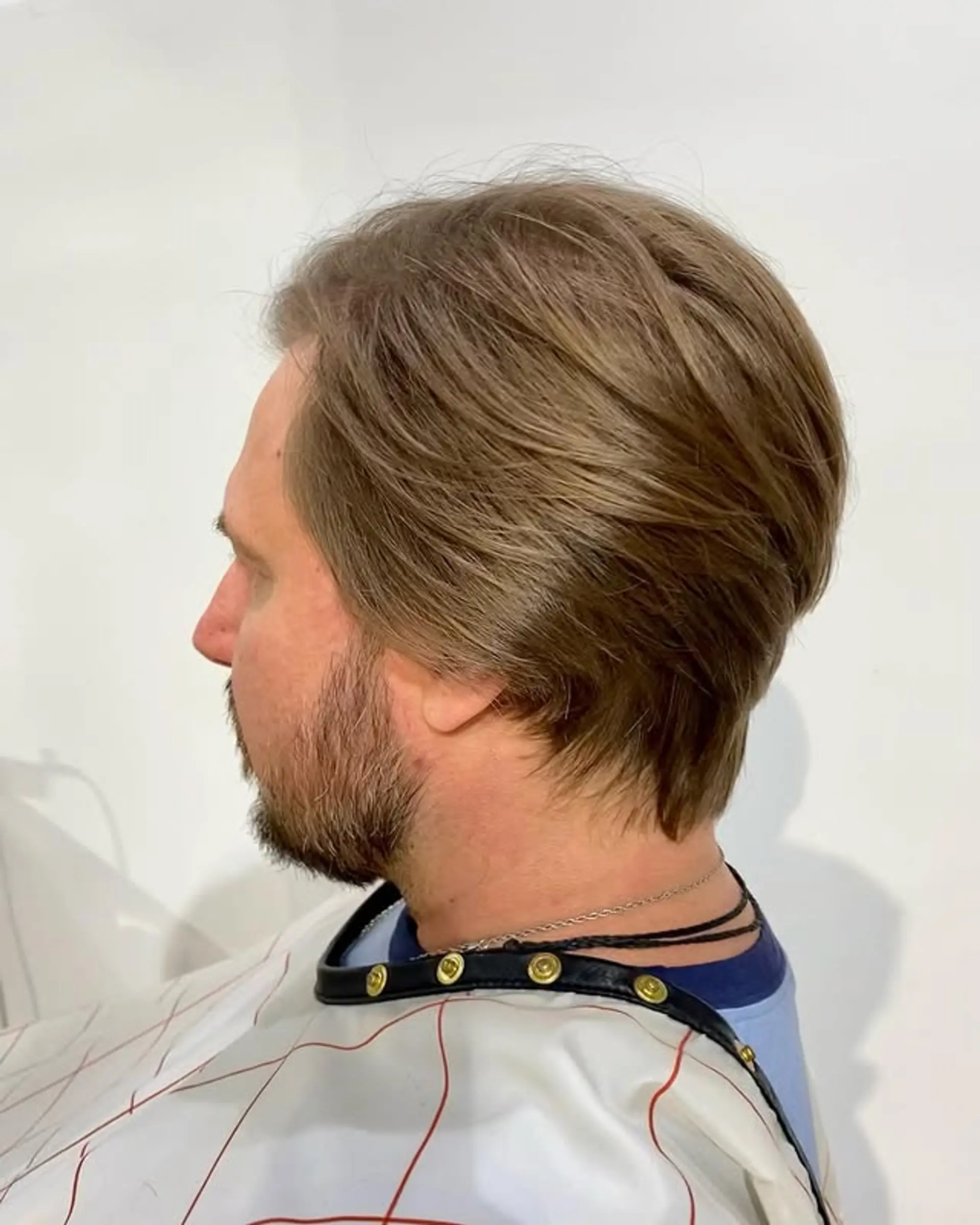 A classic tapered haircut with textured layers on top. 1