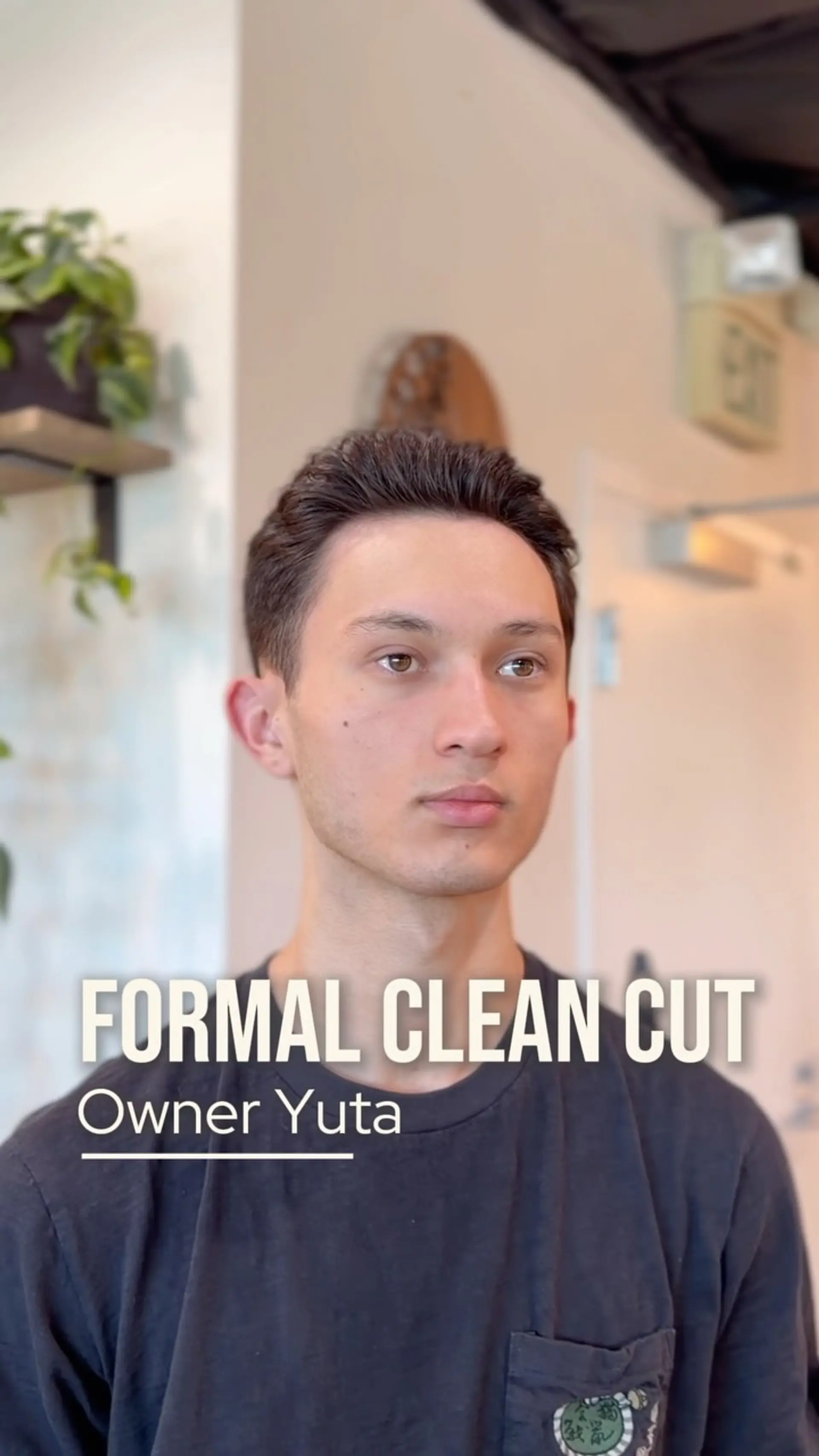 A clean, sharp short haircut styled neatly back off the forehead with tapered sides. 1