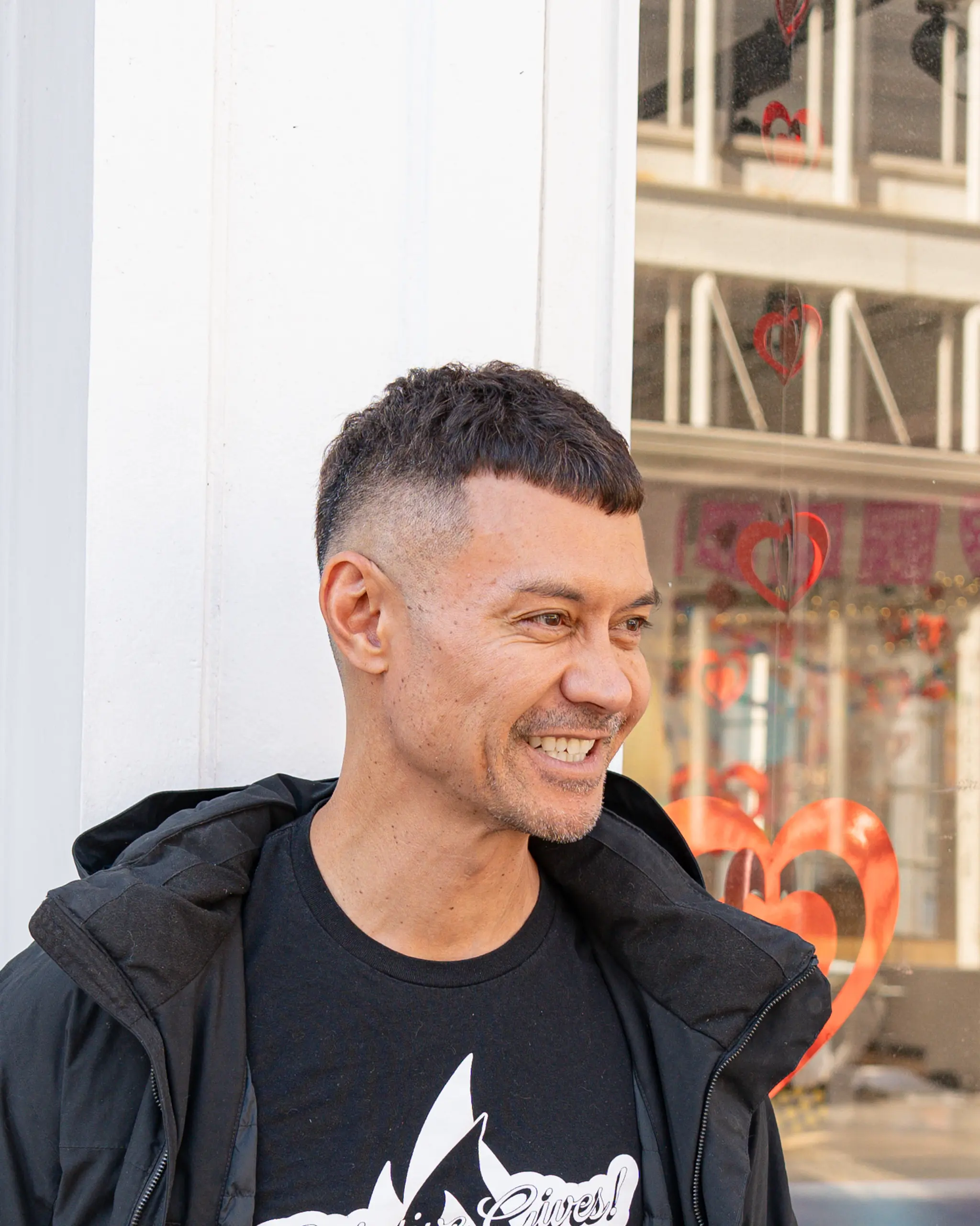 A modern buzz cut with a fade and a short, blunt French crop fringe.