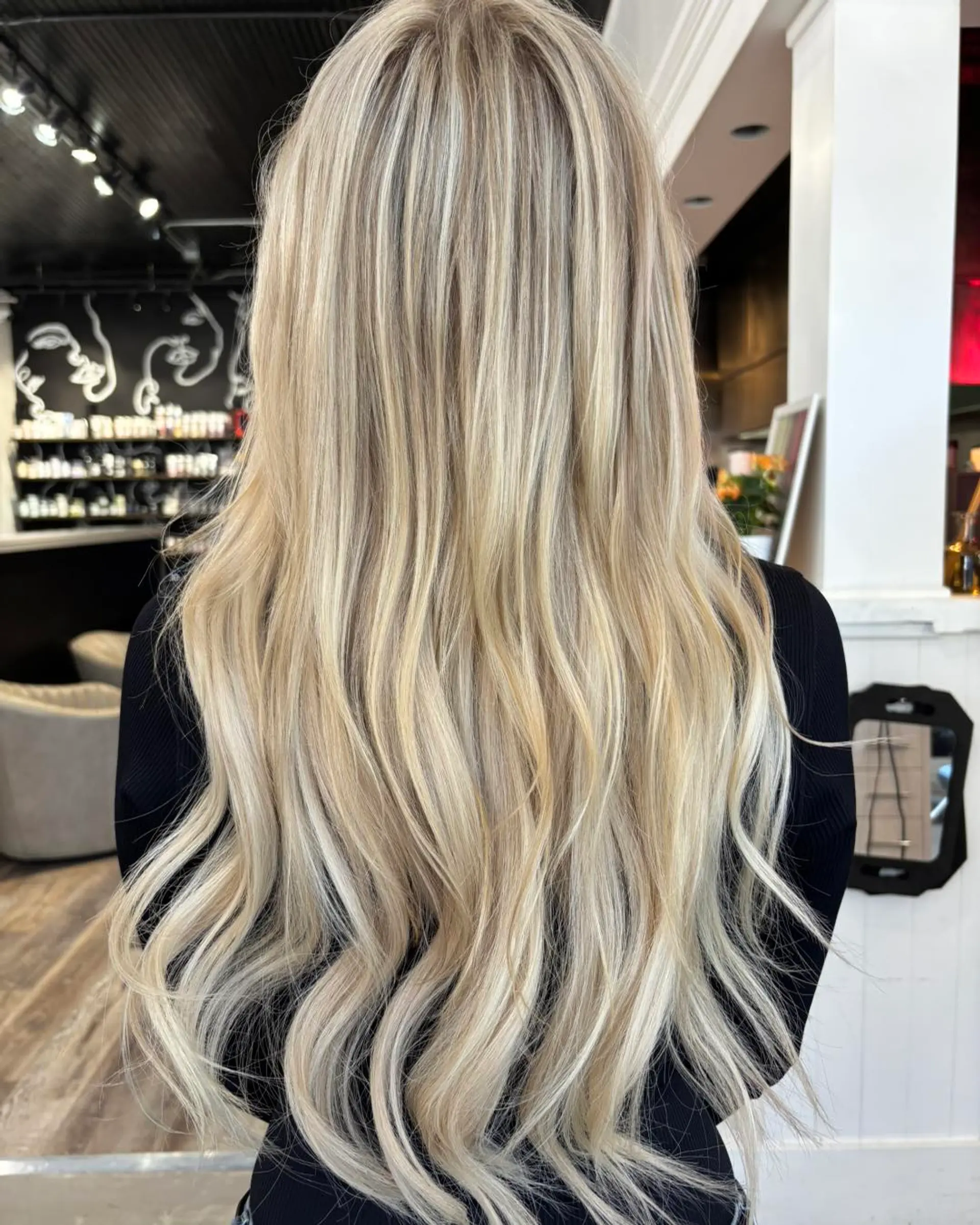 Extra-long dimensional blonde hair styled with subtle, cascading waves down the back. 1