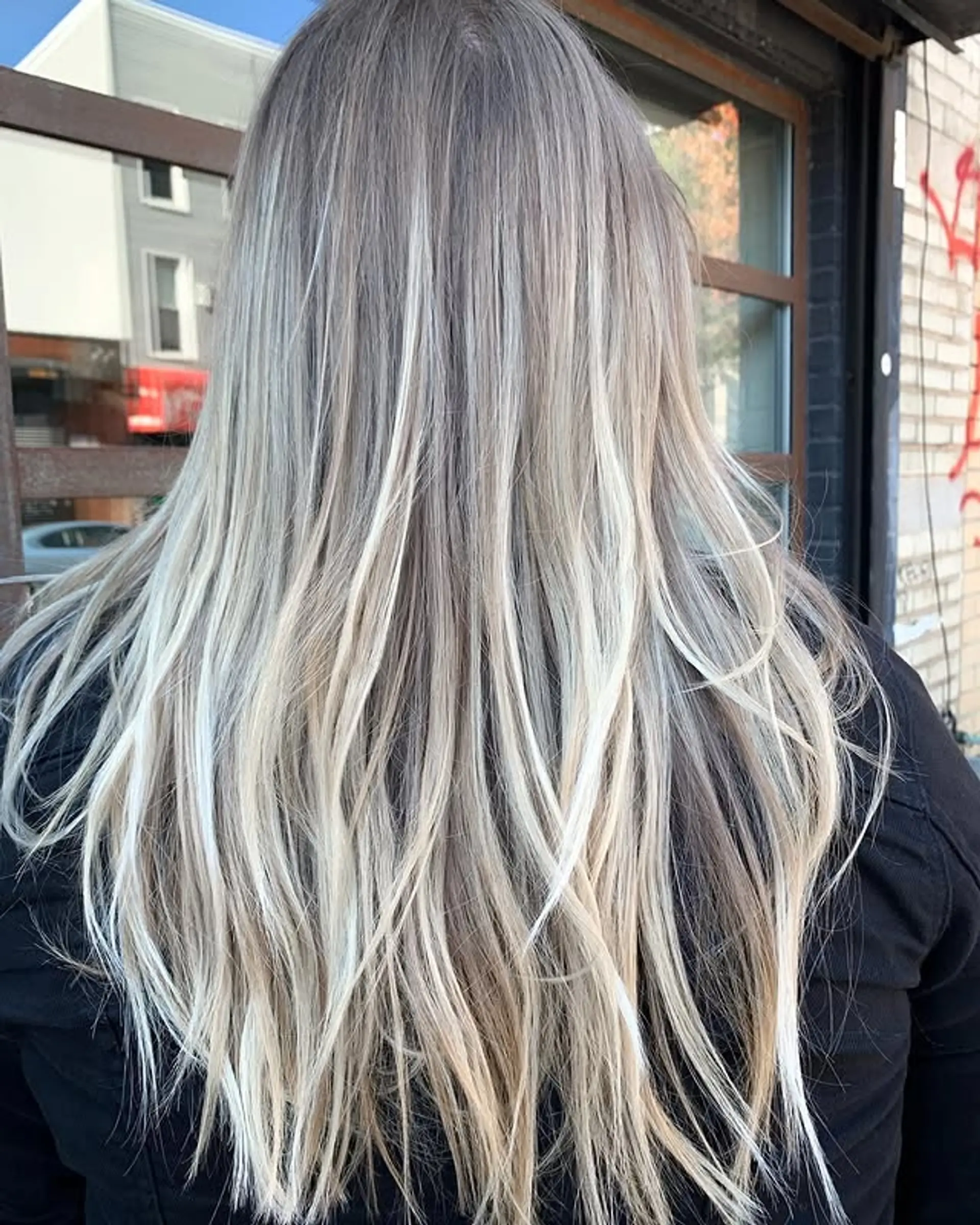 Long, straight hair with an icy blonde balayage. 1