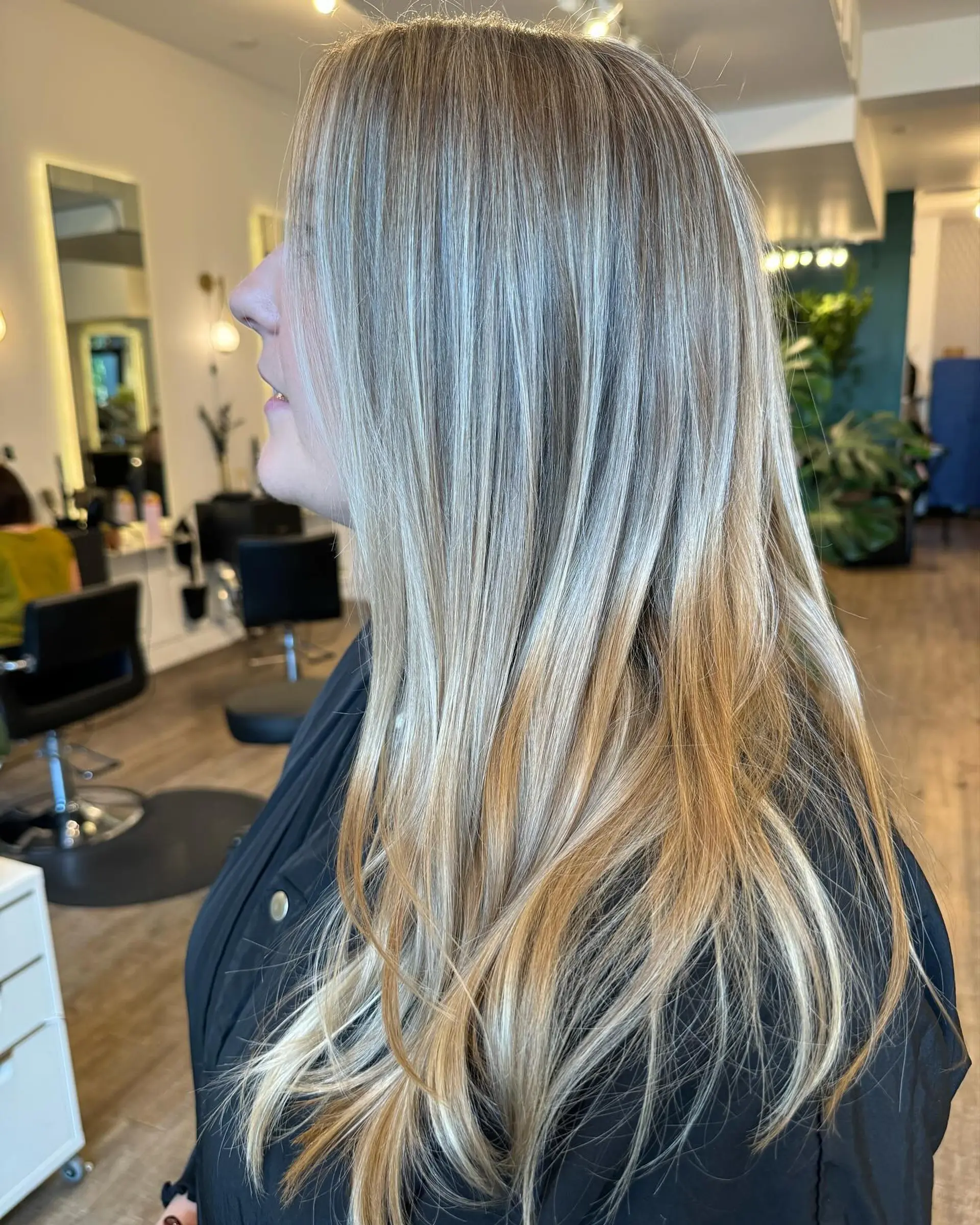 Long straight hair featuring seamless dimensional blonde highlights blended over a natural light brown base. 1