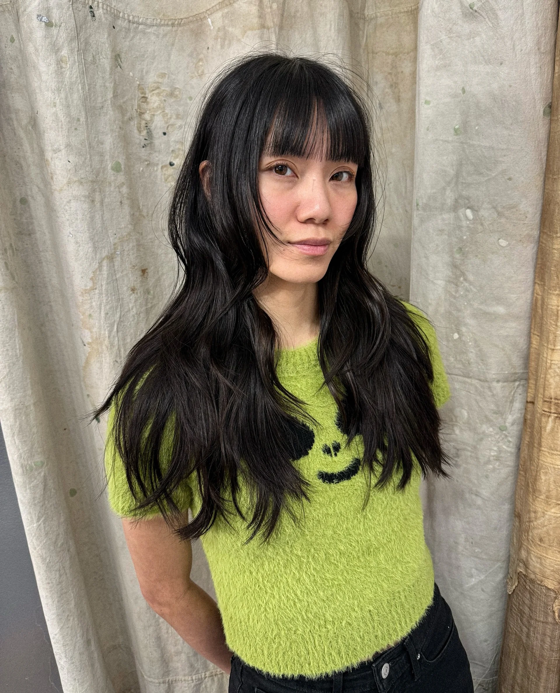 Long layered butterfly haircut with face-framing layers, embodying expressive maximalism - Preview 2