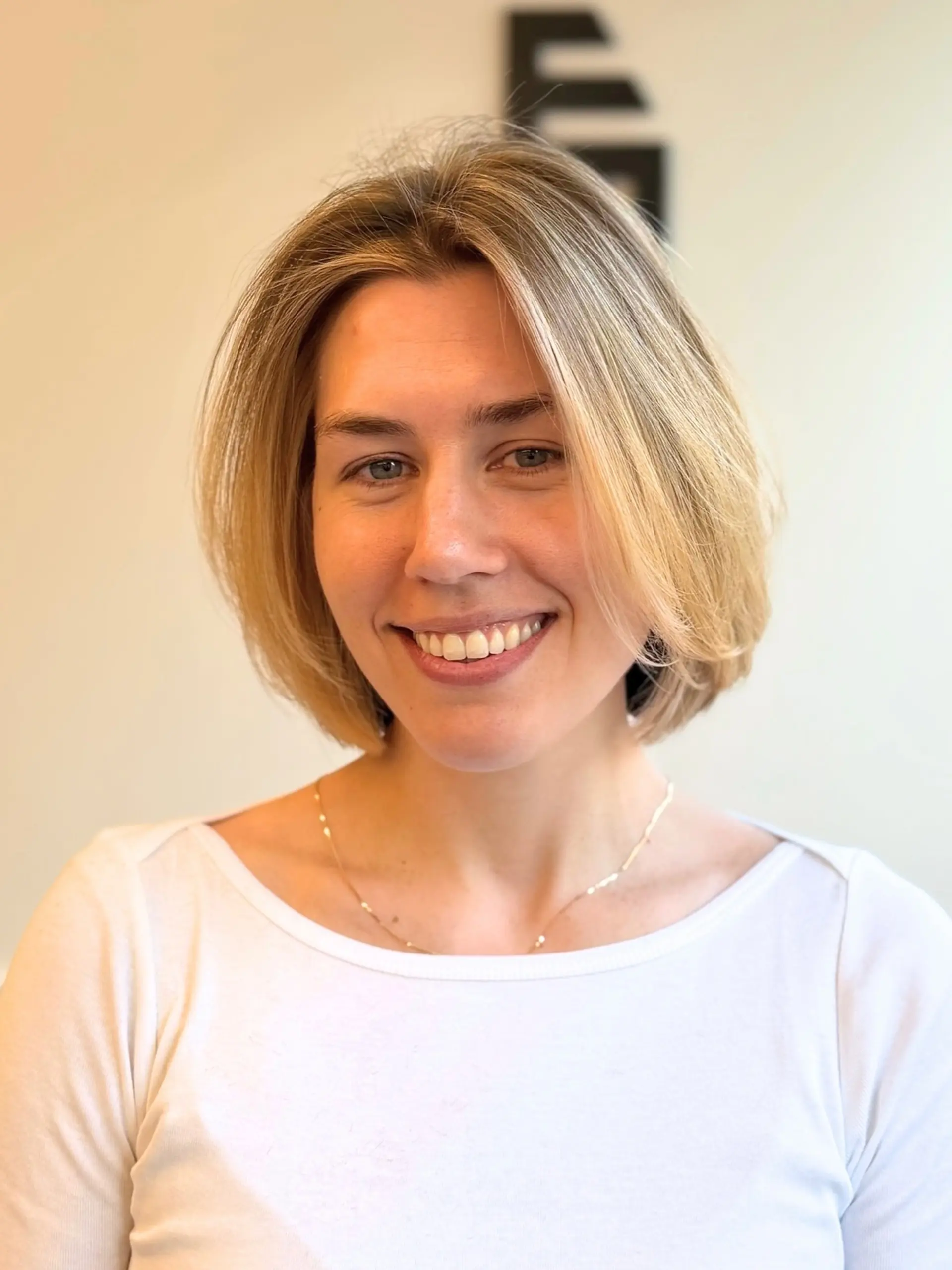 A soft, chin-length honey blonde bob with gentle volume and a natural side part. 1
