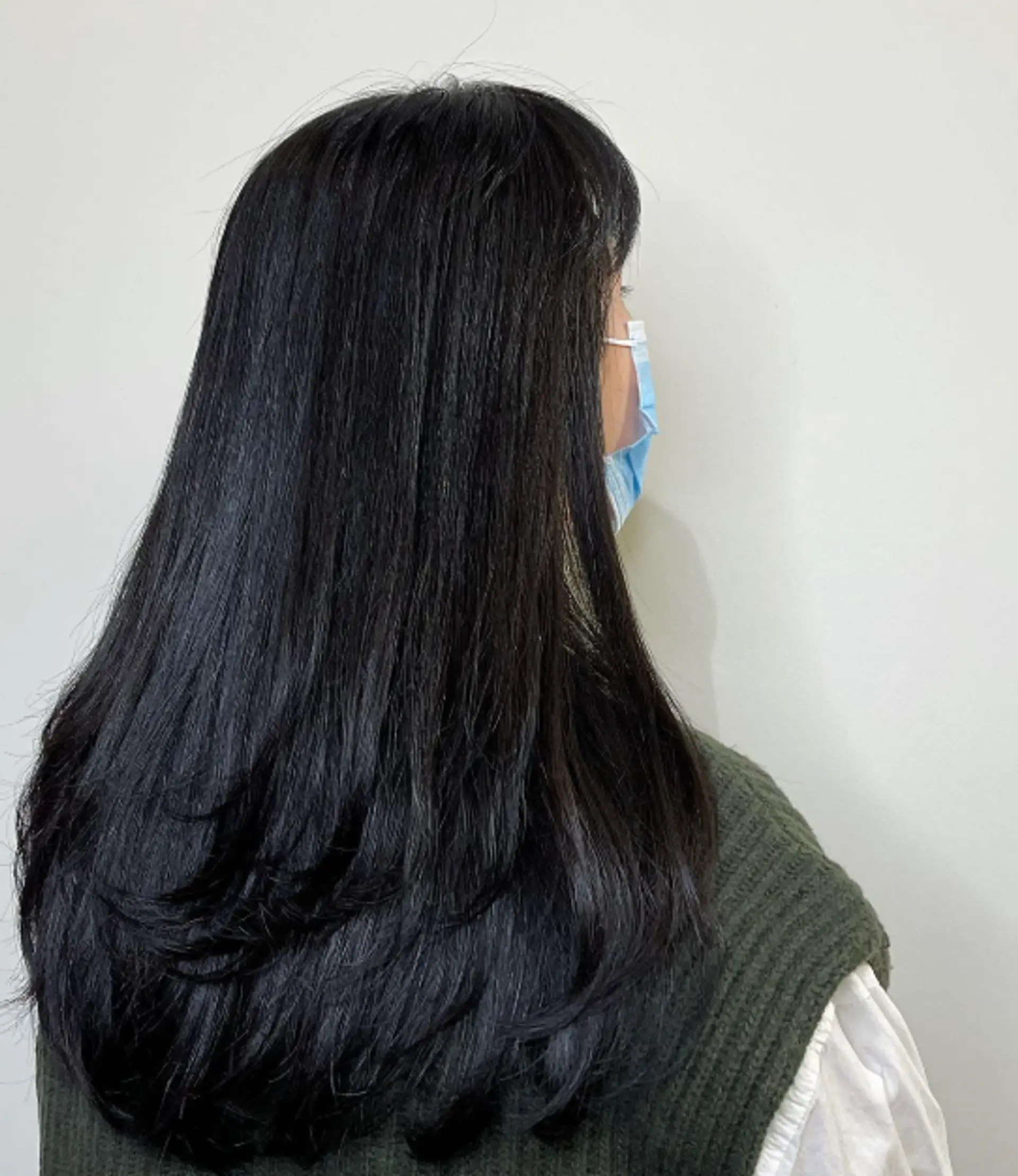 A layered haircut with sleek texture. 1