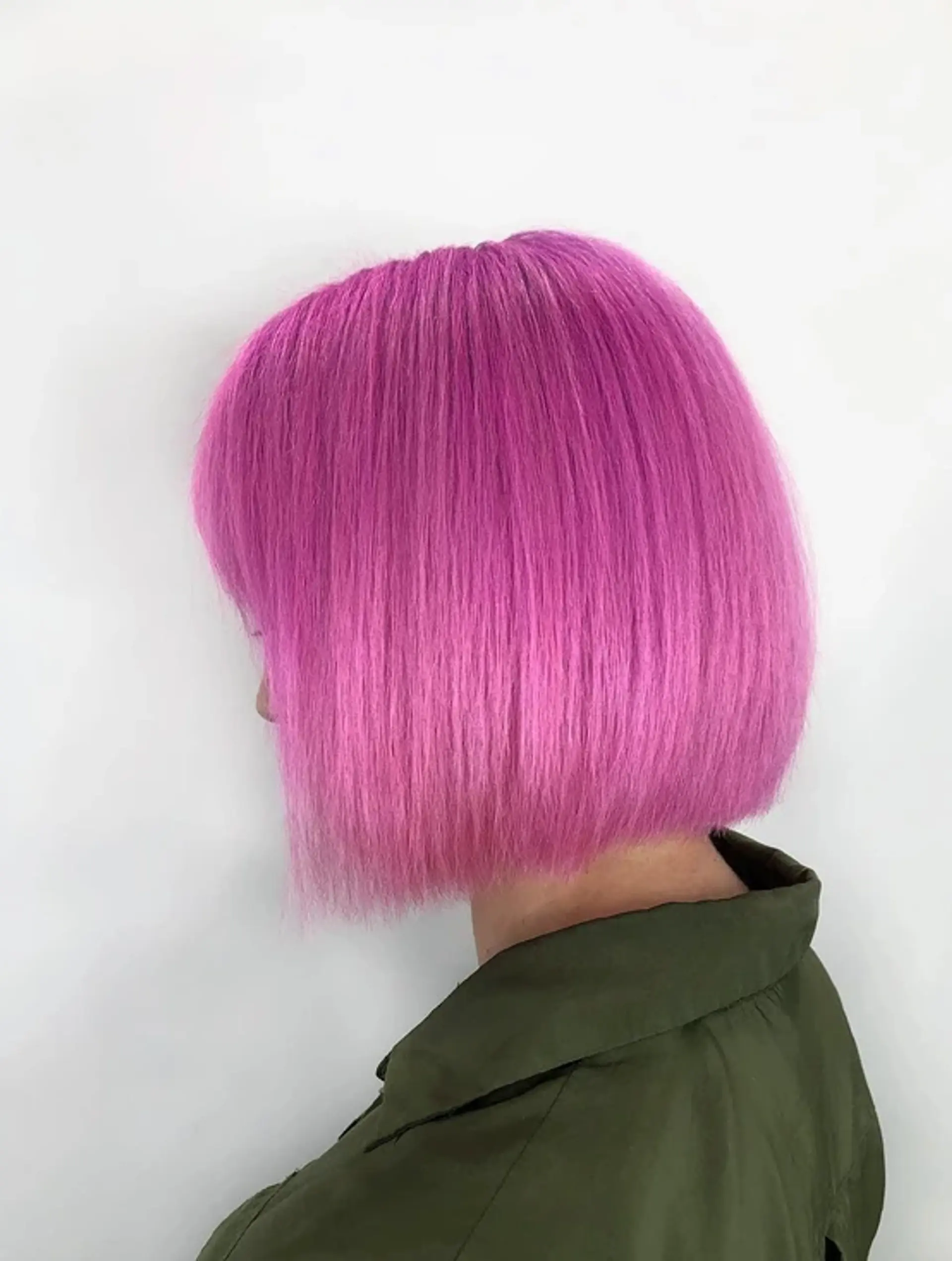 A vibrant pink blunt bob with straight, well-maintained hair, featuring a clean and precise look. 1