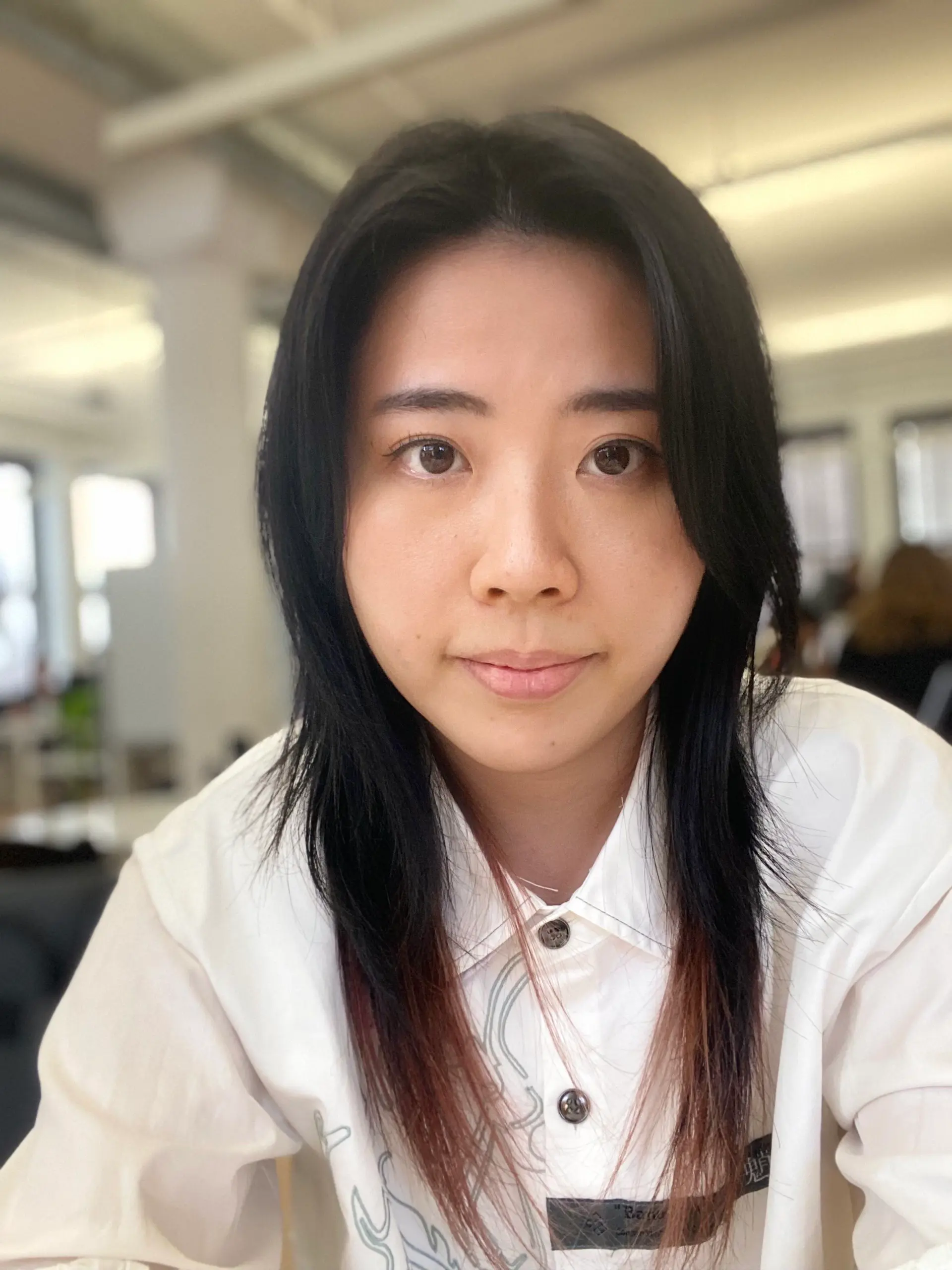 A layered long hairstyle with face-framing layers. 1