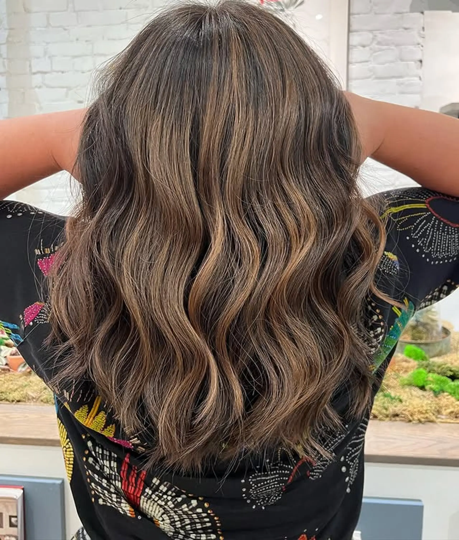 Medium length wavy hair with caramel and blonde balayage highlights. 1