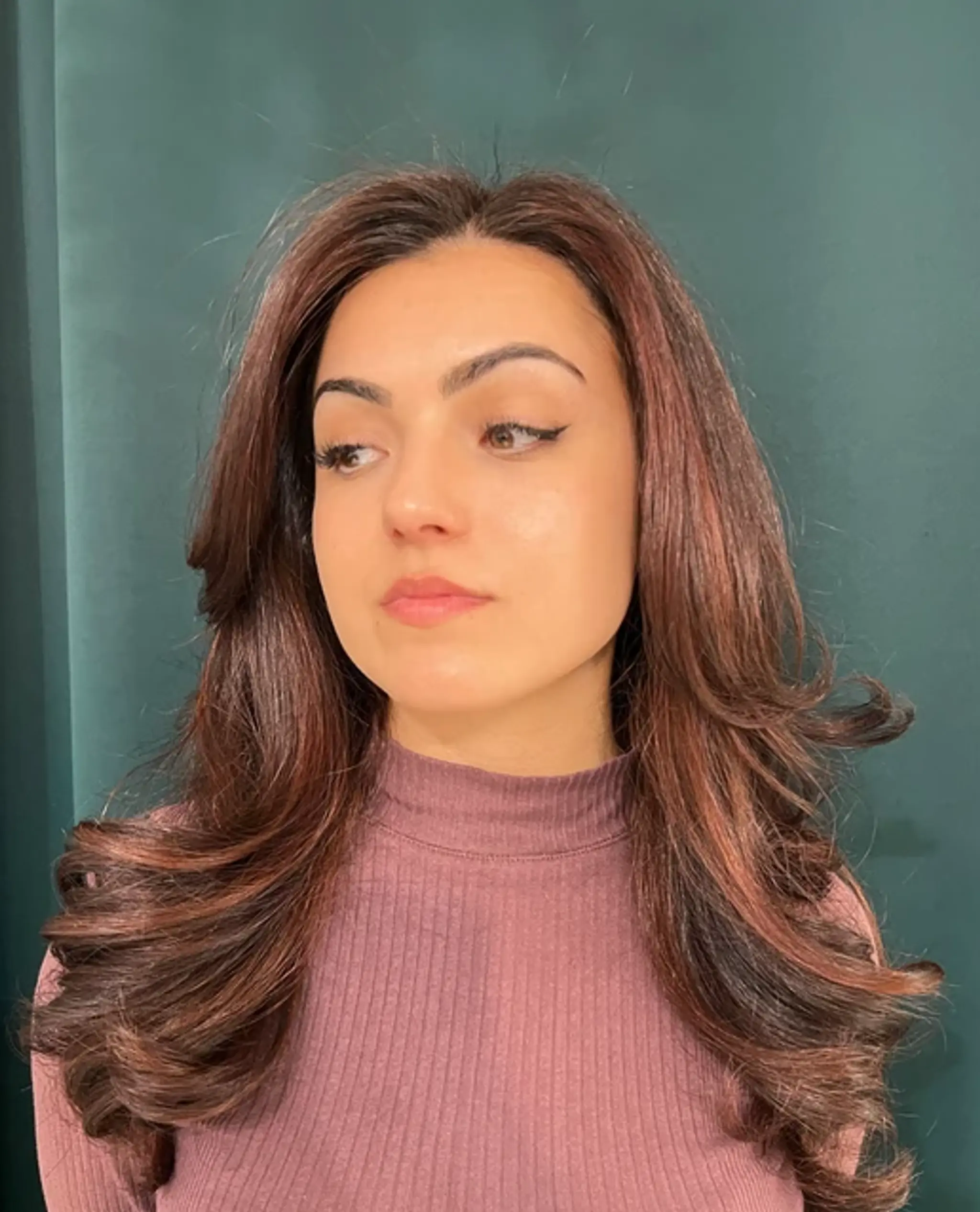Rich dark brown, chestnut hues, long and straight, with voluminous soft waves cascading elegantly, featuring face-framing layers for an added elegance. 1