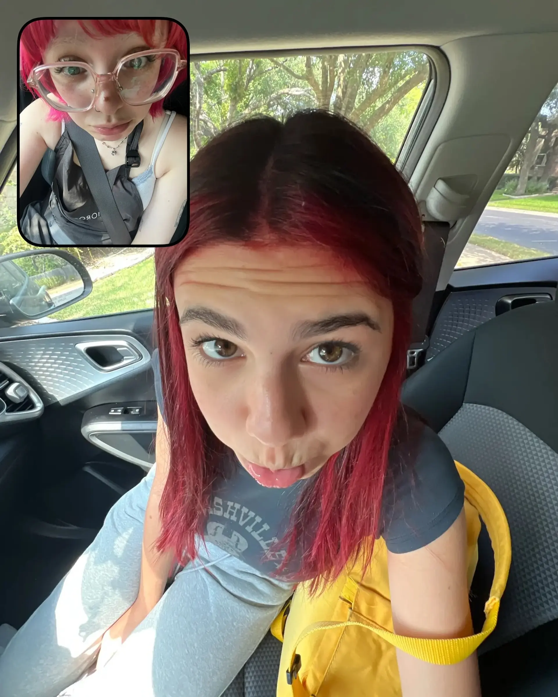 A sleek, long layered haircut adorned with vivid crimson red highlights meticulously placed over a darker base. The straight strands showcase the vibrant color contrast and natural movement, offering a dimensional and eye-catching look. 6