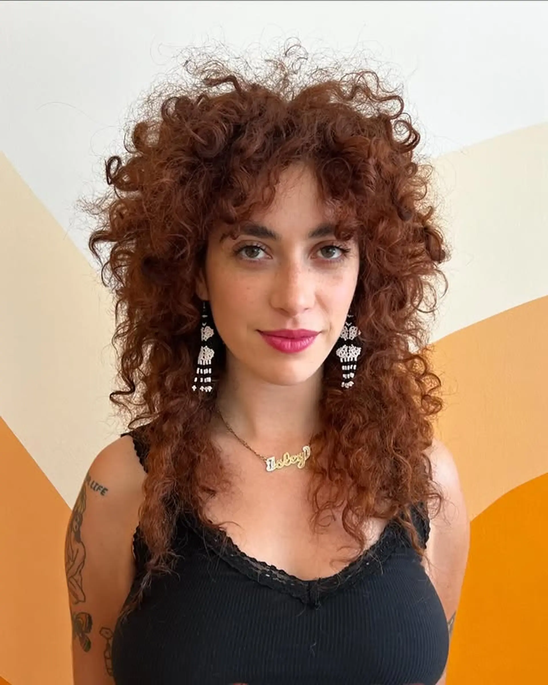 A curly shag with layered texture and face-framing bangs. 1