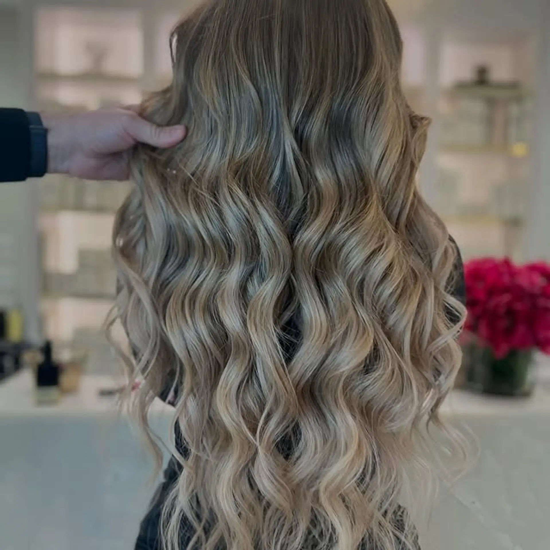 Long, wavy hairstyle with a bronde balayage and soft, natural waves. 1