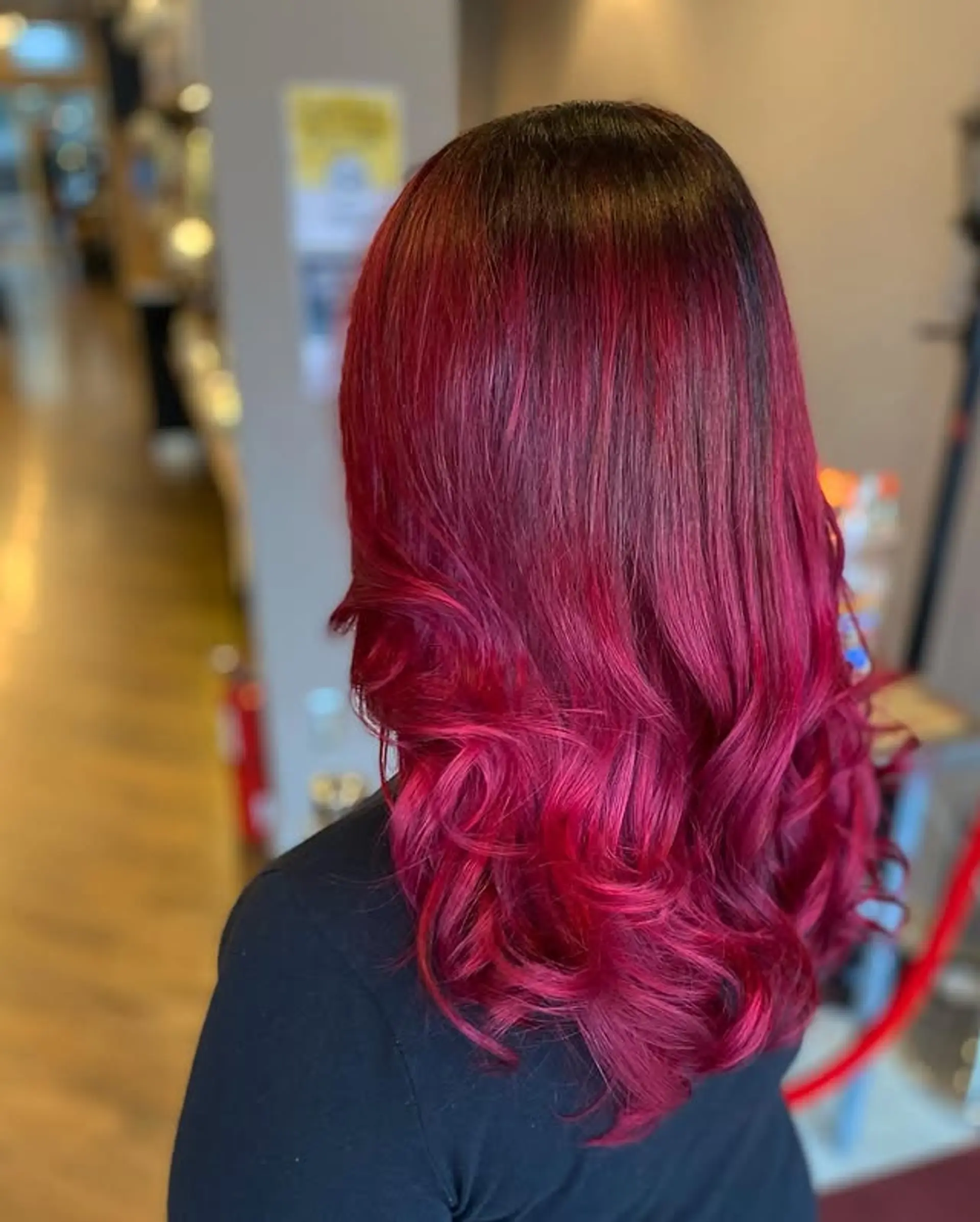 Long, wavy hair with a crimson red ombre color melt. 1