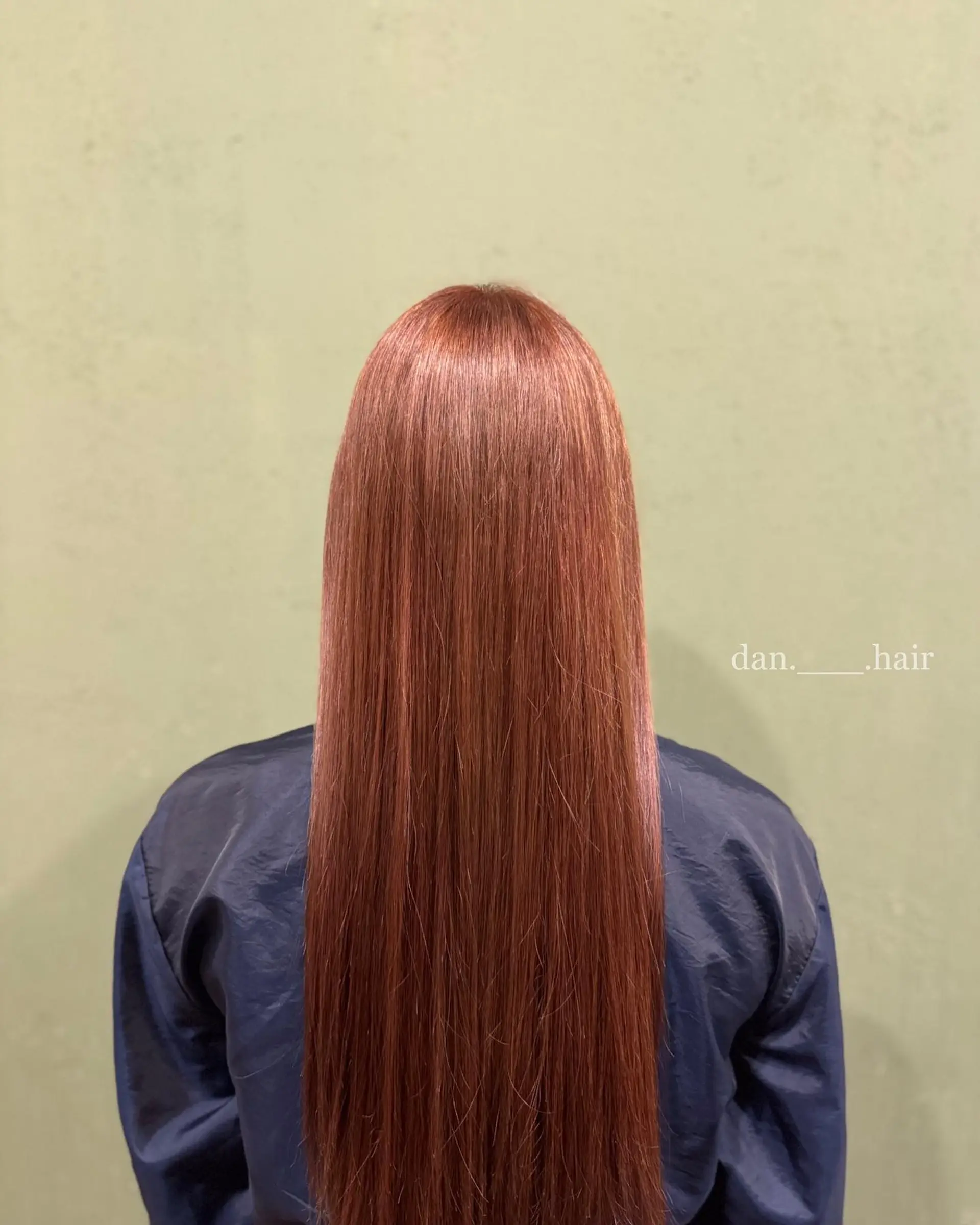 Ultra-long, pin-straight hair dyed in a vibrant, glossy orange-brown shade. 1