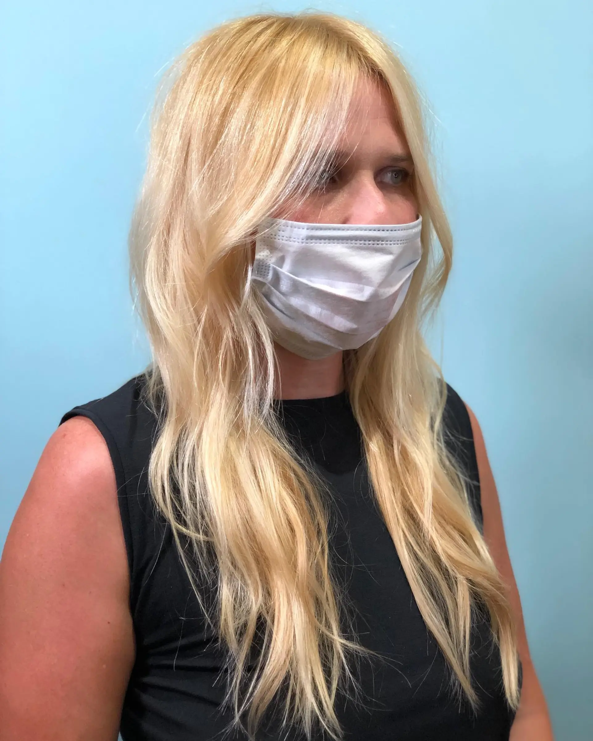 A shoulder-length layered lob with subtle beachy waves. 1