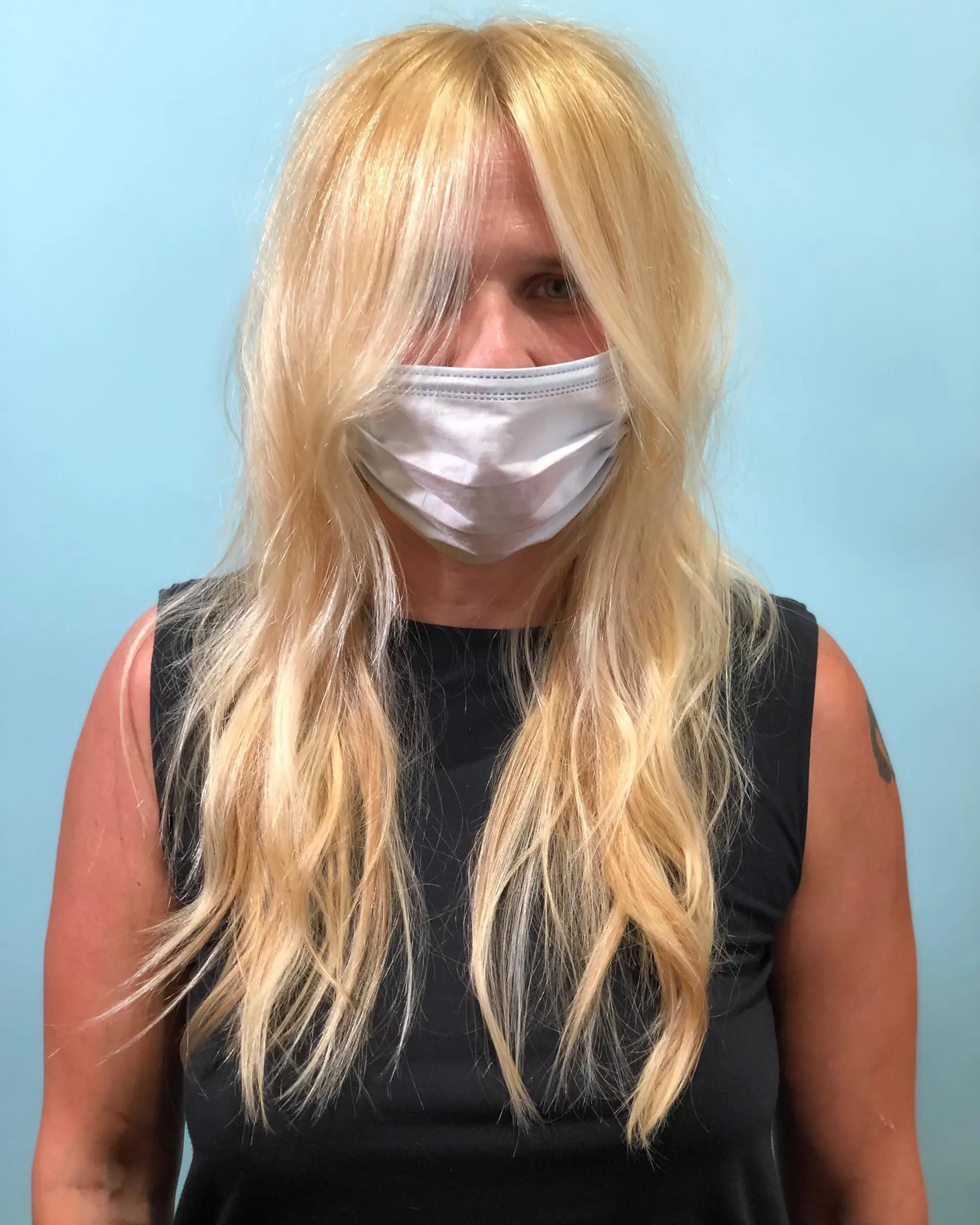 A shoulder-length layered lob with subtle beachy waves. 2