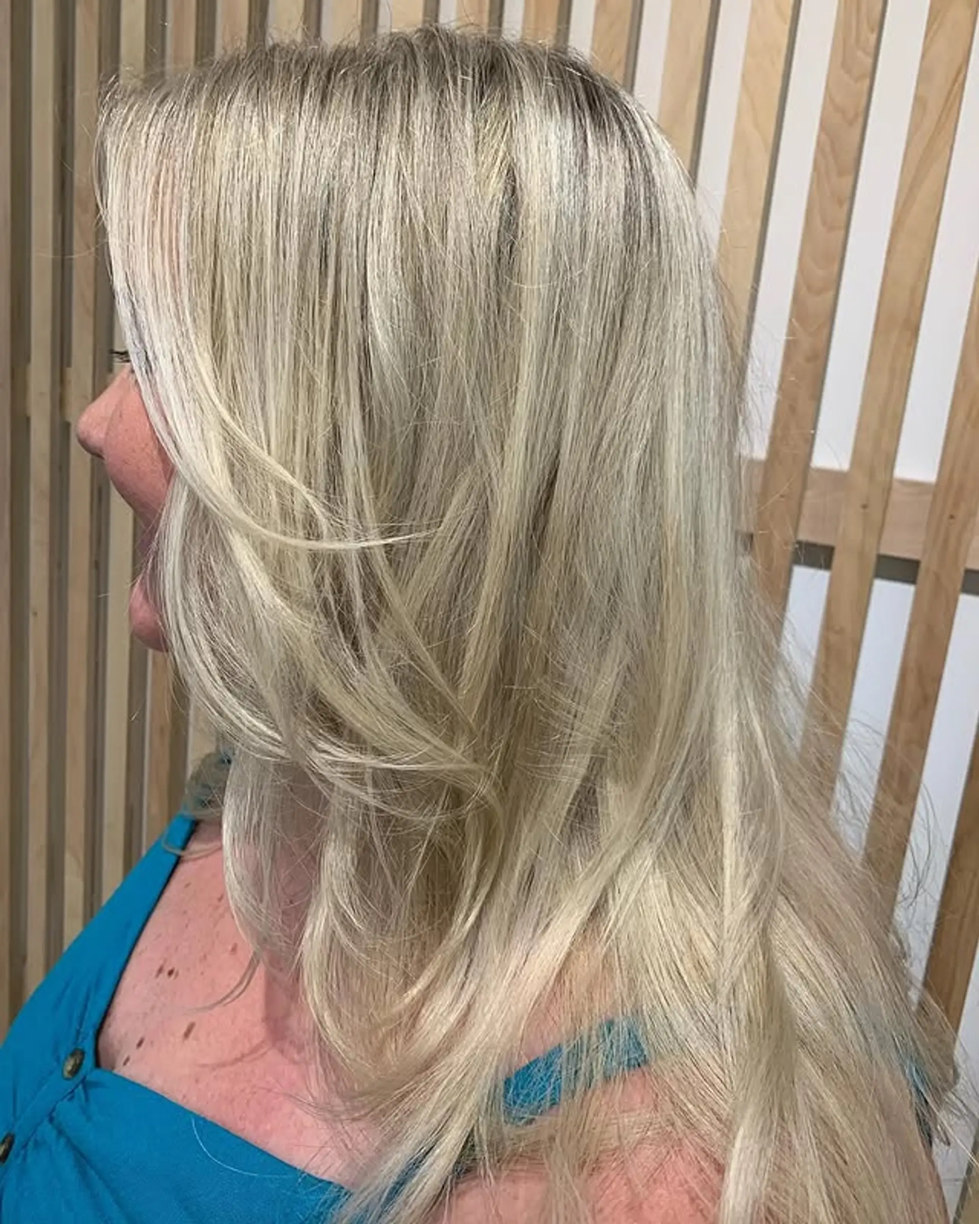 A long layered haircut with face-framing layers for added movement and style. 1