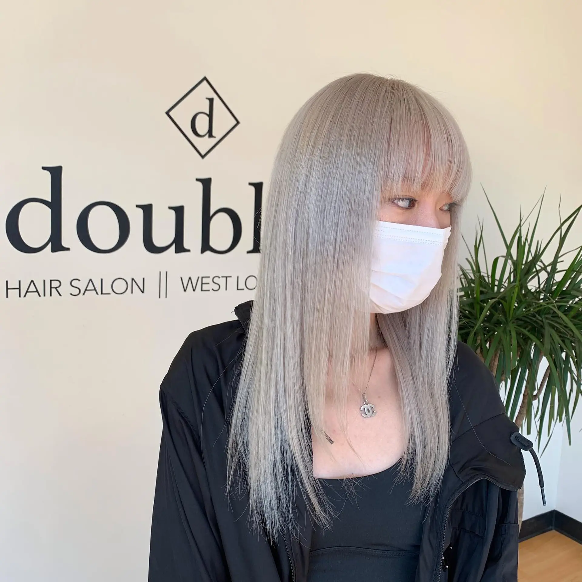 Straight, ultra-light platinum ash blonde hair styled with full eyebrow-grazing fringe bangs. 1