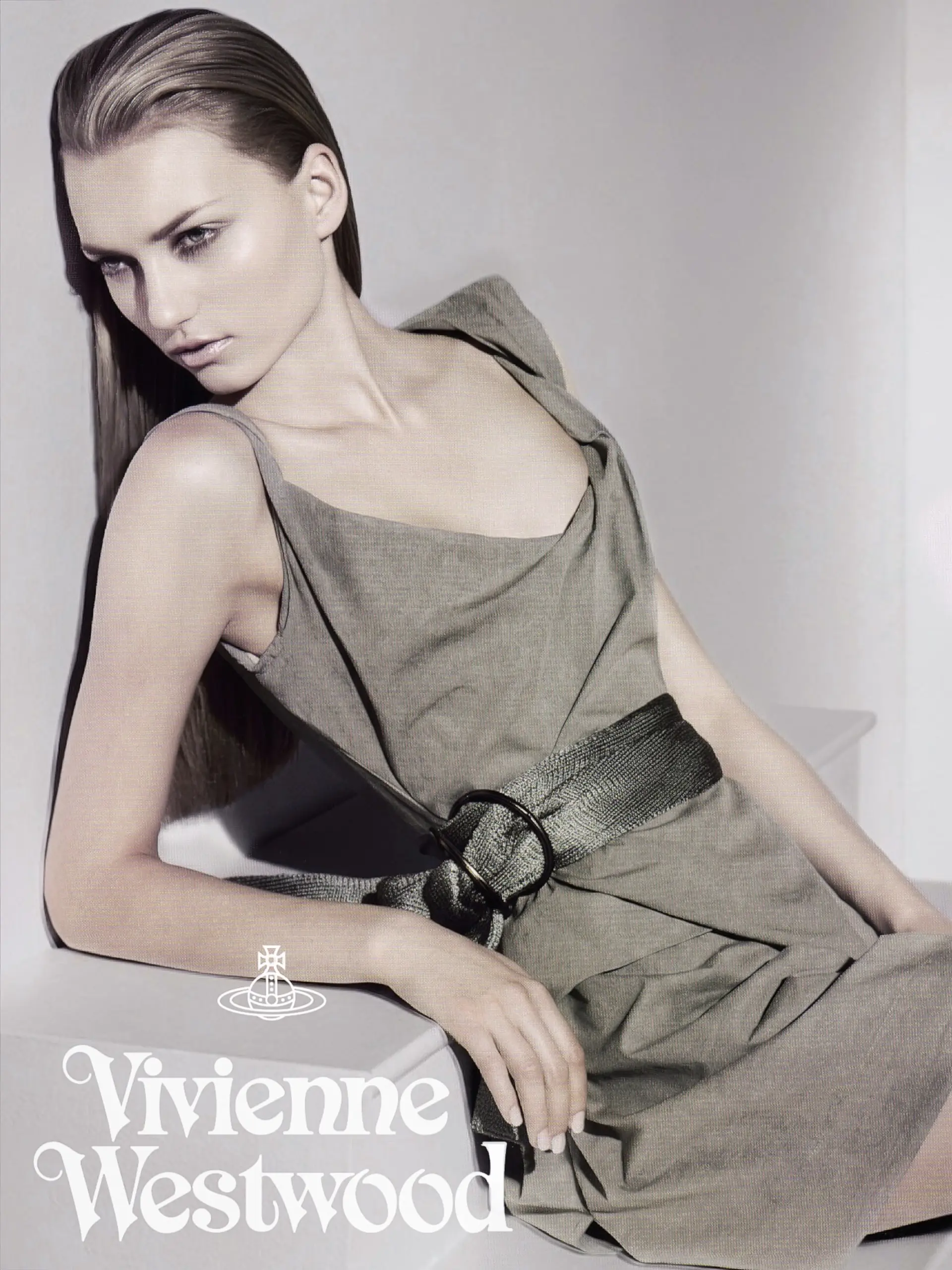 A sleek slicked-back hairstyle with straight long hair combed back smooth from the face. 1