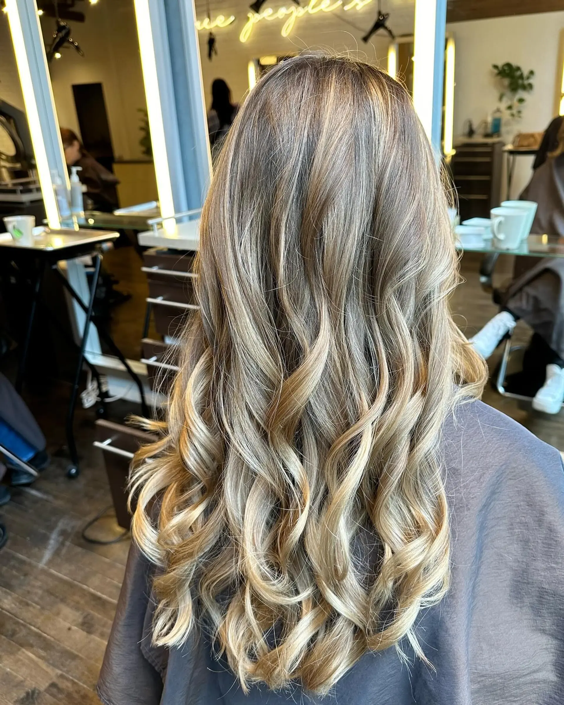 Long, soft waves with a balayage color melt. 1
