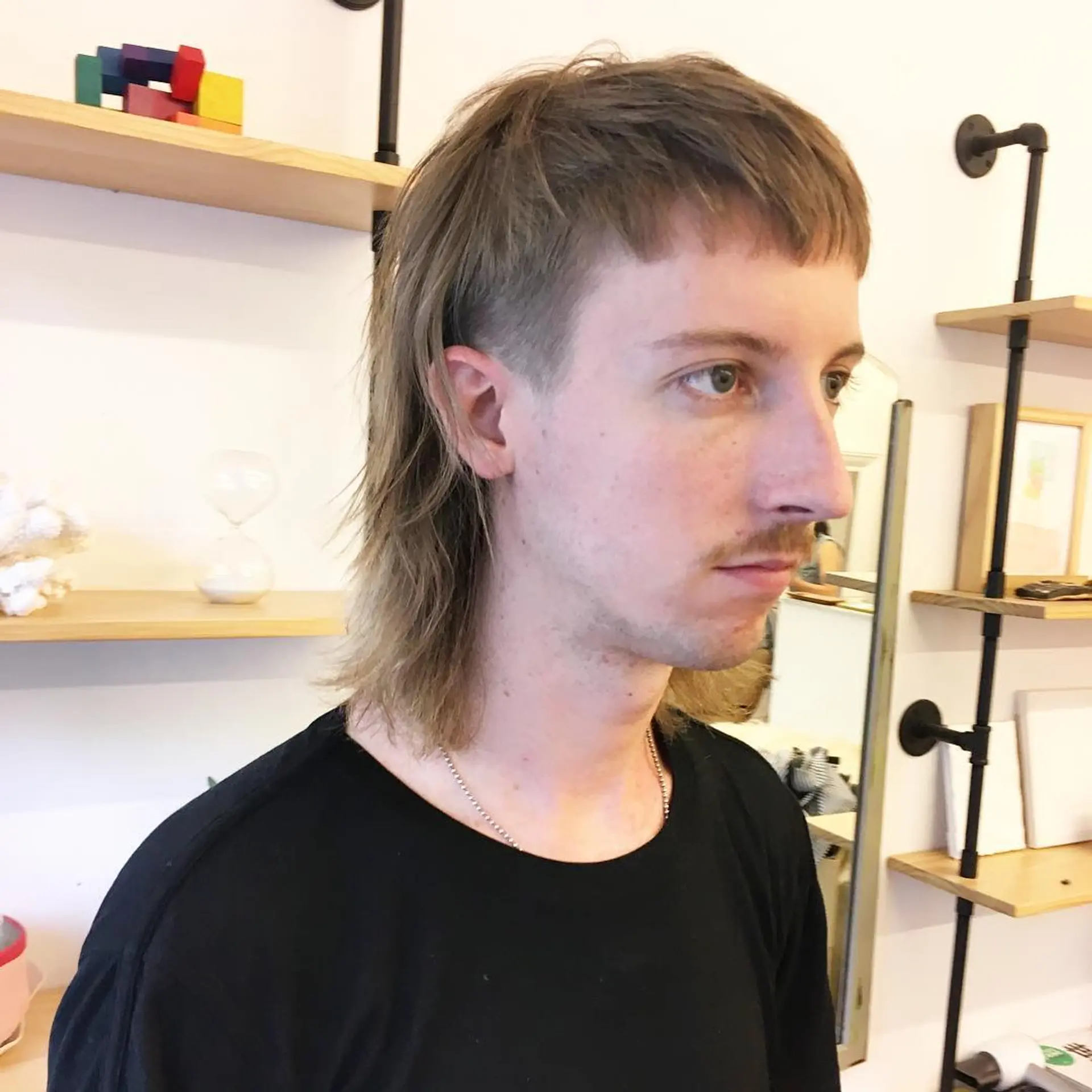 A medium-length straight light brown mullet with a flowing fringe and layered locks, and shorter trimmed sides. by @takeohair 1