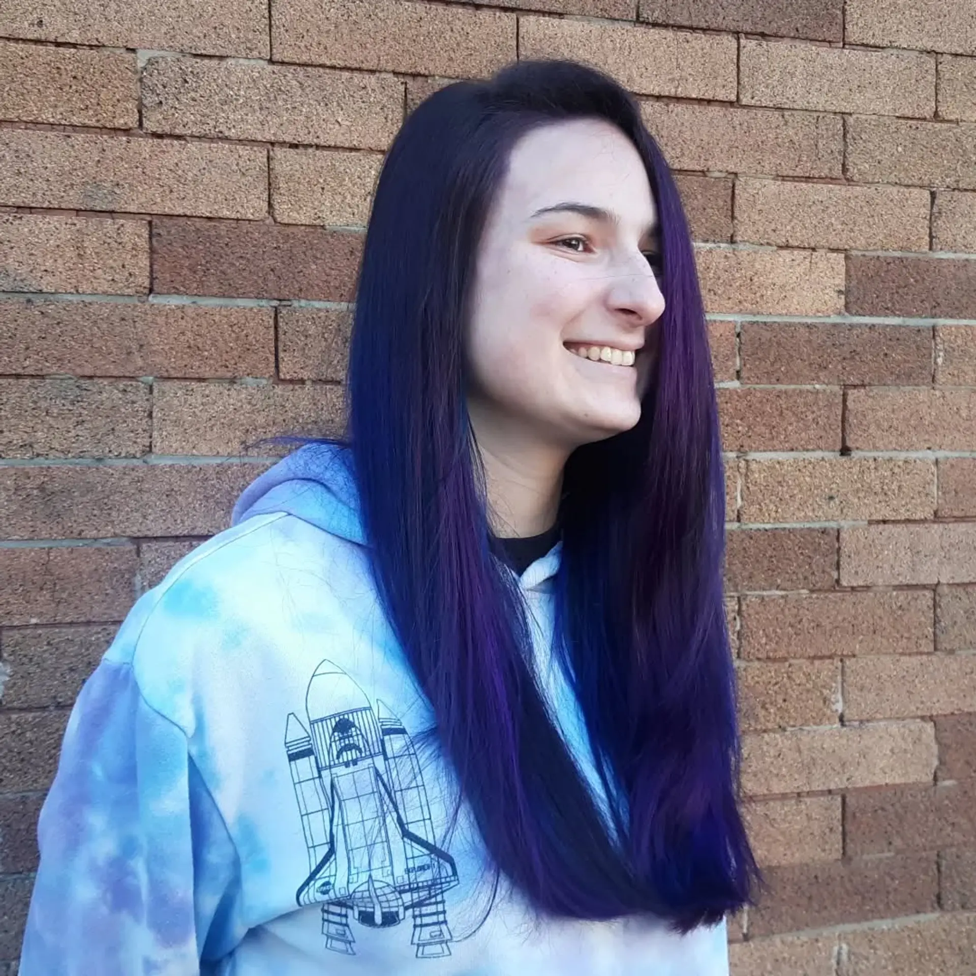 Long layered hairstyle featuring a mix of vibrant blue and purple hues. 2