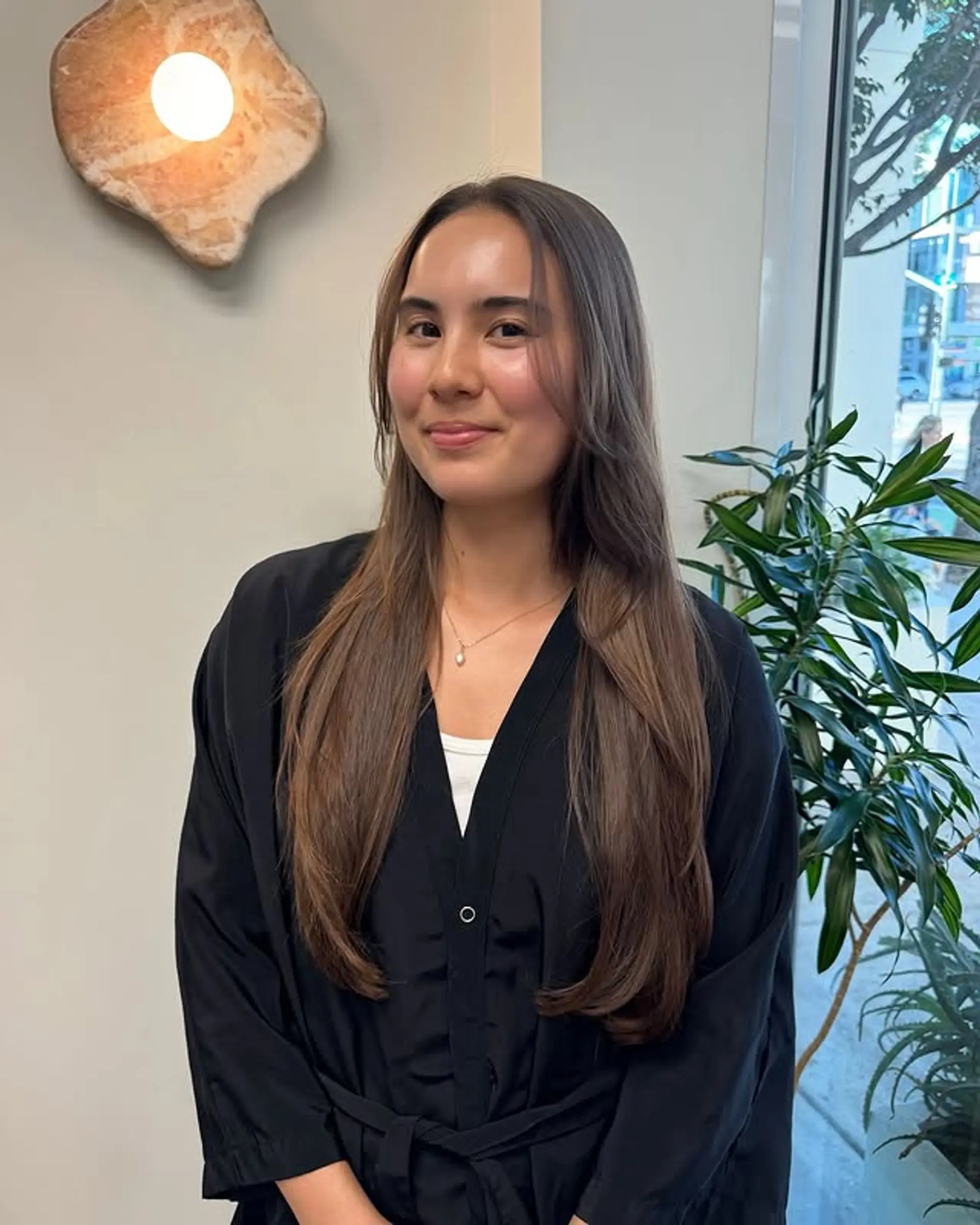 Long, layered hairstyle with curtain bangs. 1