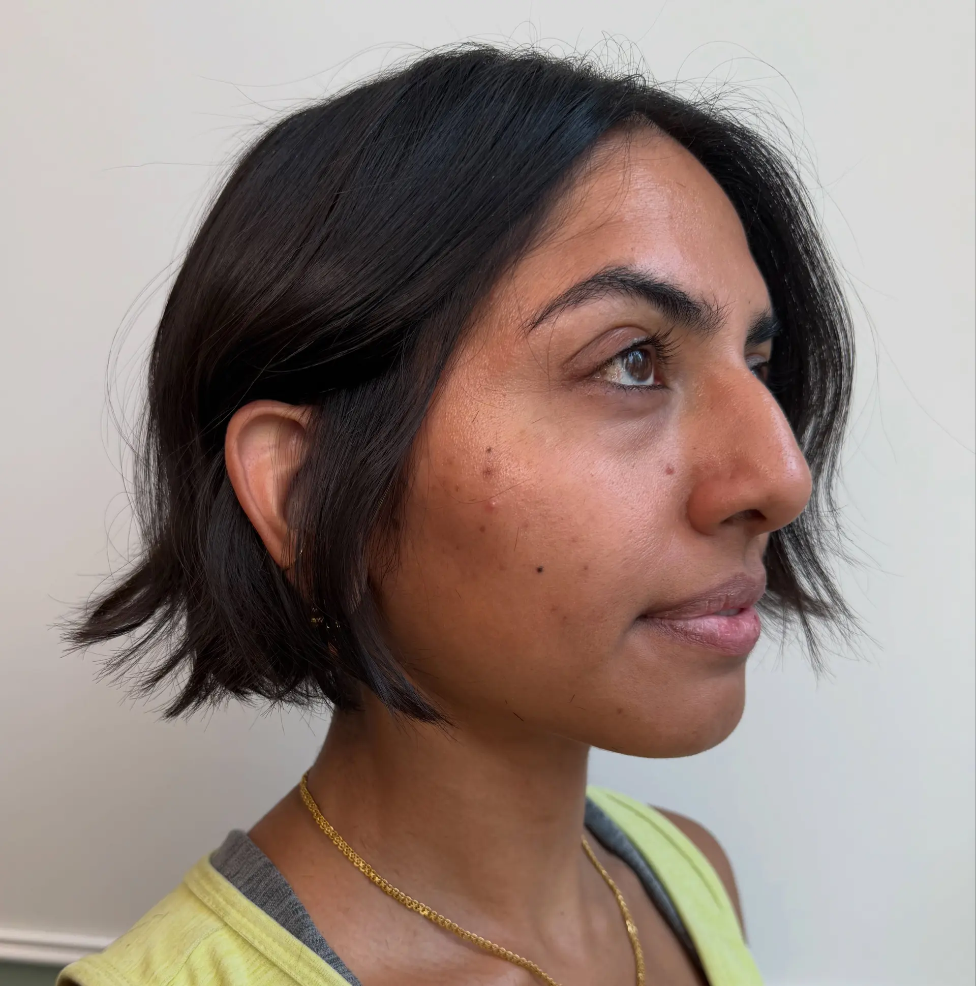 A textured chin-length French bob with subtle exterior layering and gently flicked ends. 1