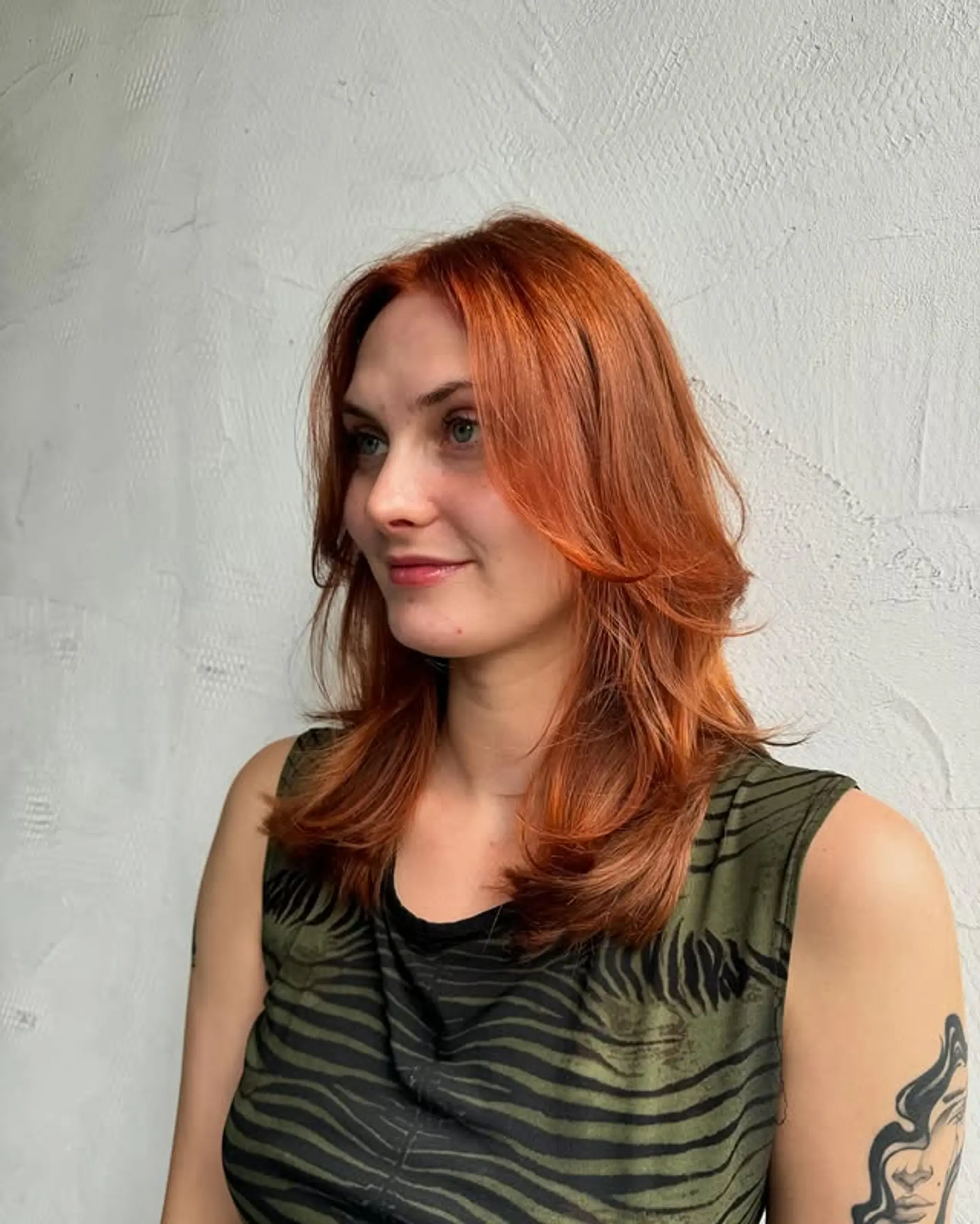 This layered haircut features soft, face-framing layers for a flattering silhouette.