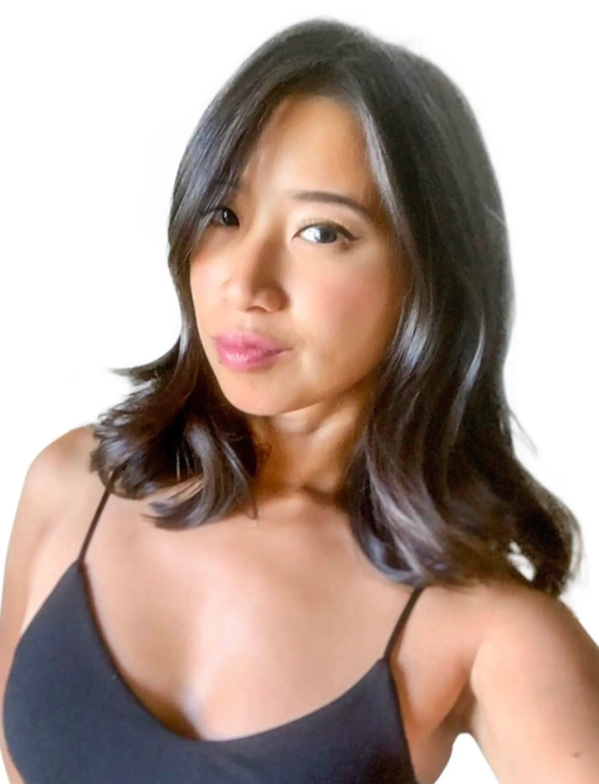 A medium-length hairstyle featuring soft, sleek waves that frame the face. 1