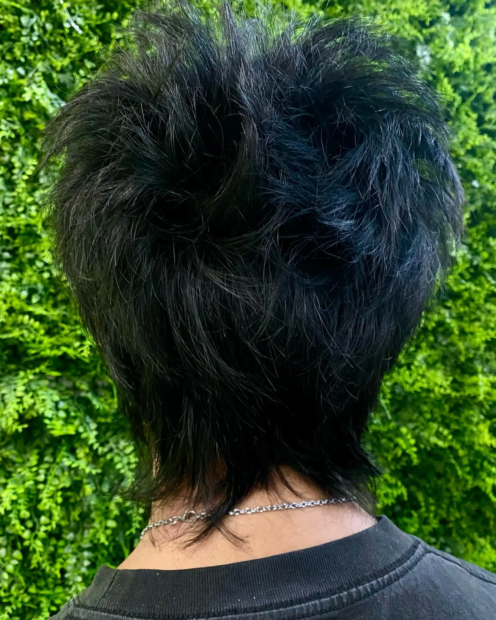 A shaggy, layered mullet with a textured and choppy finish. 1